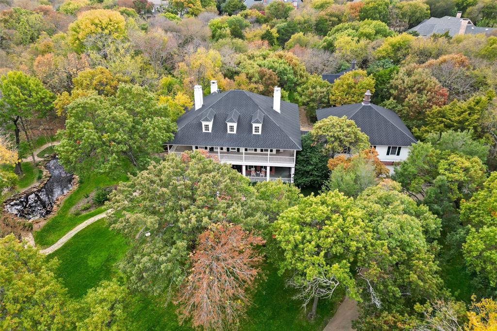 Gorgeous 1.1 acre property with flagstone walk between main home and guest house. Main home is elegant with hardwood floors, beautiful moldings, built-ins, spacious rooms, and stunning views. The walk-out basement has full bath and kitchenette, plus large gathering spaces. On your main floor, guests flow easily between the dining room, kitchen, breakfast area, living room, and study. An enormous front porch allows guests to spill outside for year-round entertaining. Five bedrooms and 4 full baths are on the second floor, including a stunning master with sitting room, custom closet, marble master bath, and exclusive access to the front deck and an expansive 3rd floor bonus room. A private apartment above 4-car garage holds a 6th bedroom as well as a full kitchen and living room. Behind your home, a 1600 SF guest home includes a fireplace, full kitchen, huge laundry area with desk, and spacious master suite with roll-in shower. 830 Quail Rise lot next door is also for sale, MLS#20214276.