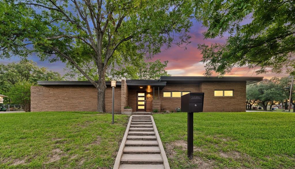 Step into a one-of-a-kind mid-century modern masterpiece in the heart of Clifton, Texas. Nestled on a sprawling corner lot shaded by mature trees and surrounded by beautiful landscaping, this meticulously maintained 2-bedroom, 2-bath home seamlessly blends timeless character with high-end modern updates.

Inside, you’ll find an impressive open-concept living, dining, and kitchen area designed for both everyday living and entertaining. Massive glass doors flood the space with natural light, creating an airy, expansive feel while offering beautiful views of the backyard. Thoughtfully remodeled throughout, the home showcases top-of-the-line finishes, stunning architectural details, and a designer-inspired aesthetic that honors its mid-century roots.

The kitchen is a true showpiece, featuring premium finishes, abundant storage, and a spacious island perfect for gathering with family and friends. The private primary suite serves as a peaceful retreat with generous natural light and a beautifully appointed ensuite bathroom.

Outdoors, the oversized backyard is a tranquil oasis. Enjoy relaxing beneath the covered porch, gathering around the rock fire pit, or unwinding beside the serene koi pond. With ample shade, mature trees, and exceptional outdoor living spaces, this property offers a rare combination of privacy, beauty, and functionality.

Whether you’re searching for a full-time residence, weekend retreat, or unique getaway property, this turn-key Clifton gem delivers character, comfort, and style unlike anything else on the market.