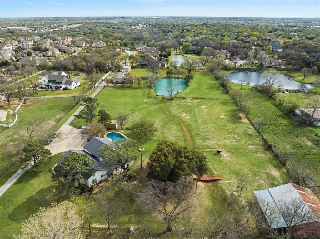 4.5 Acres in Southlake - Prime Development or Private Estate Opportunity.

Nestled in the heart of Southlake, this rare 4.5-acre property offers the perfect blend of city convenience and peaceful country living. The beautifully property offers a renovated 2,305 sq. ft. home features 3 spacious bedrooms and 4 full bathrooms, designed with modern finishes and comfortable living in mind.  Property could be subdivided into multiple lots.  

Scenic pond, and open pasture ideal for horses or livestock. Equestrian enthusiasts will appreciate the well-appointed 4-stall barn, providing both functionality and charm. Mature trees surround the property, offering privacy, shade, and a picturesque setting year-round.

Whether you're seeking a private retreat, hobby farm, or luxury acreage estate, this property delivers unmatched versatility in a prime location just minutes from shopping, dining, and Open Enrollment into Carroll ISD top-rated schools.

All information deemed accurate, to be verified by Buyer and Buyer's Agent including all schools and measurements.
