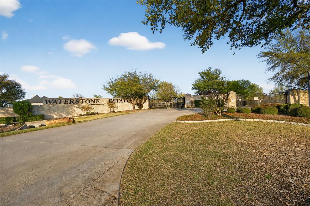 Welcome to Waterstone Estates, one of McKinney’s most sought-after gated communities, known for its mature trees, scenic water views, and peaceful estate-style setting.

Situated on over an acre in a quiet cul-de-sac, this elegant residence offers the space, privacy, and flexibility that are hard to find. The expansive lot provides endless possibilities—whether you envision a custom pool, outdoor living area, garden, workshop, or simply want room to relax and enjoy the open Texas sky.

Inside, the home features beautiful hardwood floors, a spacious three-car garage, and a well-designed split-bedroom floor plan. A dedicated home office with a built-in desk creates the perfect work-from-home setup, while oversized walk-in closets throughout the home provide exceptional storage.

The private primary suite offers a relaxing retreat with a spa-inspired ensuite bath featuring a jetted tub, separate vanities, and two generous walk-in closets. Upstairs, two additional bedrooms and a full bath provide ideal separation for family, guests, or flexible living needs.

Step outside to a welcoming patio, perfect for entertaining, hosting gatherings, or enjoying quiet evenings surrounded by the natural beauty of Waterstone Estates.

With over an acre of land, a gated community setting, and a thoughtfully designed home, this property offers more than just a place to live—it offers a lifestyle.