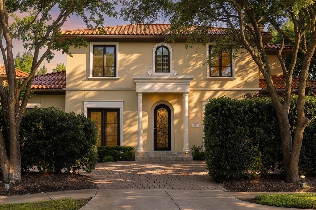 Set within the exclusive guard-gated Enclave at TPC Las Colinas, 504 Byron Court offers a rare blend of privacy, convenience, and resort-style living in one of Las Colinas’ most desirable communities. Ideally positioned on a quiet cul-du-sac, just moments from The Nelson Golf & Sports club that’s easily accessible by golf cart. The home also enjoys close proximity to core Dallas, DFW International Airport, the Toyota Music Factory, and major business corridors. Inspired by Mediterranean design, the residence is framed by lush landscaping and enhanced by added privacy, with mature trees and thoughtfully placed greenery creating a secluded backyard retreat. Expansive glass doors invite natural light throughout, establishing a seamless connection between indoor and outdoor living, where a private yard, spa, and mosquito misting system create an ideal setting for year-round enjoyment. The kitchen has been thoughtfully updated with quartz waterfall countertops, chef-caliber appliances, two under-counter wine refrigerators, and a new full-size refrigerator, offering both function and style for everyday living and entertaining. The reimagined primary suite serves as a true retreat, complete with a private patio, expansive dual vanity, frameless walk-in marble shower, freestanding spa-like bath, and dual walk-in closets. Recent enhancements further elevate the home’s comfort and efficiency, including a new HVAC system, new water heater with recirculation pump, new washer, updated powder room, and wiring for ceiling speakers. With over 3,900 square feet of well-appointed living space, 504 Byron Court offers the ideal balance of sophistication and ease within a secure, amenity-rich community defined by golf, privacy, and accessibility.