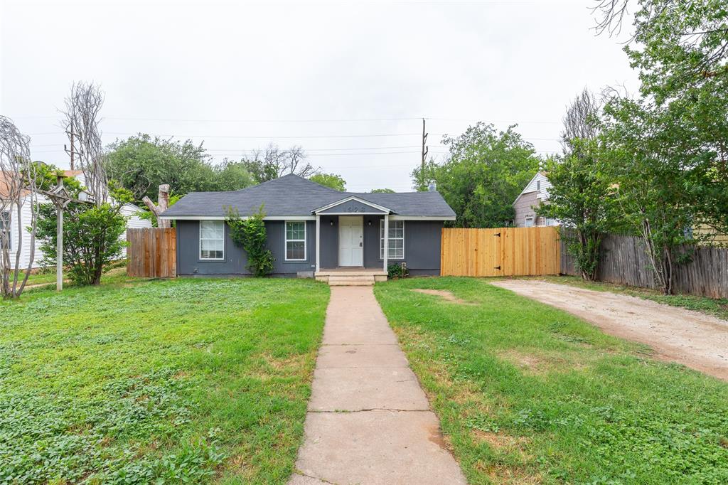 Four bedroom, two bath home with two fireplaces and an eat-in kitchen. Interior features luxury vinyl plank flooring throughout, with electric range and ample cabinet space in the kitchen. The primary bedroom includes a walk in closet, an attached bath with a soaking tub and a double sink vanity. The backyard features a fenced in yard and a storm cellar.