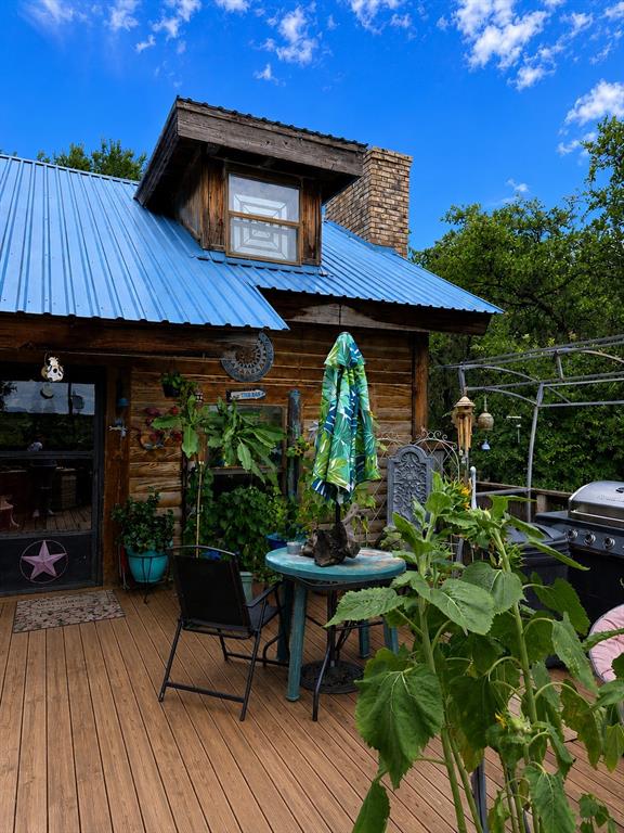 Welcome to Thunderbird Bay at beautiful Lake Brownwood! This unique home offers rustic charm with endless potential. Built with a log cabin design and complemented by a brick exterior on one side, this property is perfect for those seeking a weekend retreat, full-time residence, or investment opportunity. The property needs a lot of TLC and cleaning up.

A staircase leads to the main entrance, where you'll find a spacious patio ideal for relaxing and enjoying the peaceful surroundings. Beneath the patio is a two-car carport and a large storage room, providing plenty of space for vehicles, lake toys, and equipment.

The home features 2 bedrooms and 2 bathrooms. The lower level includes a bedroom, full bath, living room, kitchen, dining area, oversized pantry, and laundry room. The open-concept living space is highlighted by a cozy wood-burning fireplace, creating a warm and inviting atmosphere.

Upstairs, you'll find an additional bedroom, full bath, and a loft overlooking the main living area below, adding character and flexibility to the floor plan.

Step directly from the back door into the backyard, where a little TLC could transform the space into a private oasis. Enjoy watching deer wander through the property while taking in the peaceful Lake Brownwood setting.

Residents of Thunderbird Bay enjoy access to community amenities, including a swimming pool and boat dock. The annual HOA fee is less than $300 per year.

With a motivated seller and endless possibilities, this property is ready for its next owner. Whether you're looking for an Airbnb, vacation getaway, or primary residence, this home offers incredible potential at an affordable price. Schedule your showing today and bring your offer!