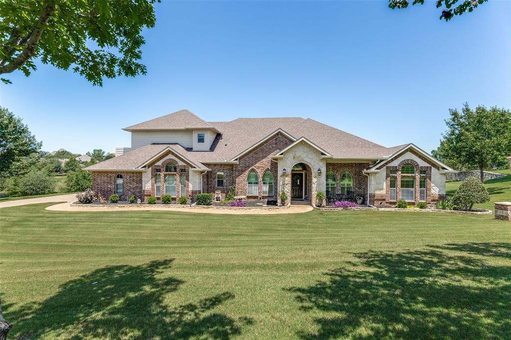 Welcome to this home that perfectly blends space, comfort and scenic beauty. Featuring three bedrooms, two and half bathrooms and a dedicated home office or 4th bedroom, this thoughtfully designed home offers plenty of room for both everyday living and entertaining. The home boasts a spacious kitchen offering an abundance of cabinet space and ample countertop workspace for meal preparation, breakfast bar that will accommodate several barstools, two dining areas along with three versatile living spaces that provide endless possibilities. One of the best features is the private balcony off of the upstairs living area overlooking a beautiful pond.  Enjoy breathtaking views, peaceful mornings, and spectacular sunsets from this serene outdoor space.  A three car garage ensures ample storage and parking space.  All of this sits on 1.62 acres in a desired gated community that offers a community pool, playground and walking trails. Close to Eagle Mountain Lake and easy access to retail and entertainment. NO CITY TAXES  Call to schedule a tour today!