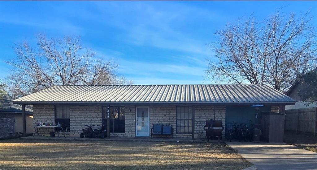 Great brick 4 bedroom 2 bath home on large lot with no HOA! Conveniently located close to the high school and the Historical Granbury Square. Features a metal roof, upgraded primary bathroom and kitchen, large lot with mature trees and a brand new 10x8 storage shed. A newly poured 10 ft slab across the back of the home will allow you to create the outdoor living area of your dreams. Seller has all new metal for porch and is willing to leave.  The garage has been converted into a bedroom-flex room, the inside of home has been recently painted, new water heater and the AC was replaced in 2023. Seller offering upto $5k SC for any repairs needed, rate buy down or closing costs with acceptable offer. This would make a great rental for investors or a first time home buyer. All information deemed reliable but not guaranteed, buyer and buyers agent to verify all info.