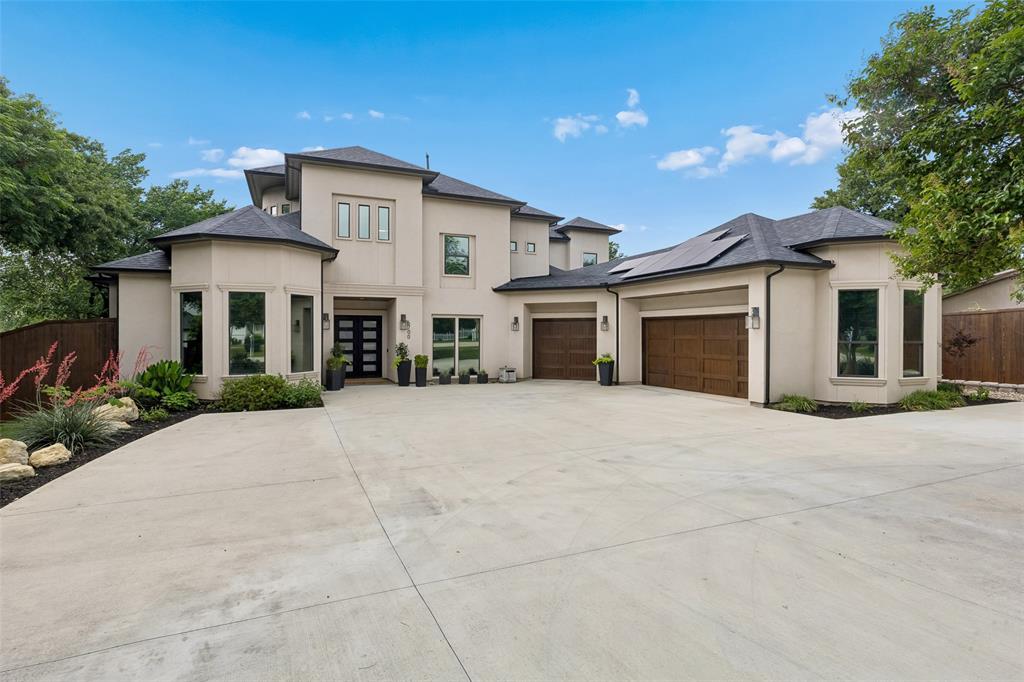 Step into refined luxury in this stunning 6 bedroom estate. Primary and 2 additional bedrooms located on the main floor. The outer shell, roof and slab were constructed in 2017 with a fully realized interior completed in 2022. The open concept floor plan is elevated by white oak hardwood flooring, designer lighting and seamless transitions between living, dining and kitchen. Kitchen features Wolf gas range, subzero refrigerator, and custom cabinetry. Entertain effortlessly with the adjacent wet bar featuring Bosch dishwasher, kegerator and ice machine. Upstairs you will find a wine cellar that chills up to 270 bottles. Situated on just under a half acre lot, no HOA. A resort style saltwater pool, completed in 2024, anchors the beautifully turfed backyard, while the fully equipped outdoor kitchen creates the perfect setting for year round entertainment. Energy efficiency meets long term savings with solar panels owned outright and fully transferable to buyer. Incredible location, walking distance to shopping, dining, and parks. Zoned for Keller ISD with open enrollment for GCISD. Every element of this home has been curated for comfort, style, and elevated living- offering a rare opportunity to own an exceptional property in a prime location. See docs for more.