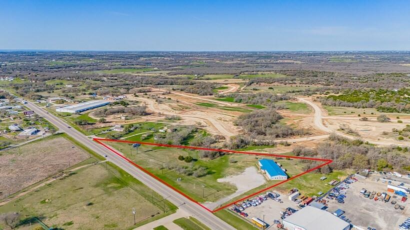 This 6,814 SF commercial facility on 5.01 acres offers a rare opportunity for buyers seeking a versatile property with significant expansion potential. Located just six miles north of I-20 along FM 51, the site provides excellent accessibility and visibility with approximately 750 feet of frontage.

The building is currently configured with a 2,500 SF auditorium, multiple private offices, classrooms, two conference rooms, a full kitchen, and generous storage areas. This layout supports a wide range of commercial uses, including office, educational, religious, training, or event-based operations.

Because the property sits outside city limits, it benefits from no zoning restrictions, allowing maximum flexibility for future use. Existing infrastructure includes well and septic systems, and the site features monument signage and strong arterial exposure.

With substantial excess land, the property is well suited for future development, outdoor storage, additional buildings, or facility expansion. Offered at $1,600,000, this asset combines functional improvements with a strategic location in a growing area of Weatherford, making it an attractive acquisition for both investors and owner-users.
