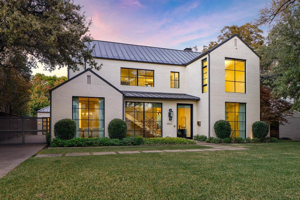 Welcome to this stunning transitional masterpiece, located on a premiere tree lined street, in the heart of the coveted Devonshire neighborhood. This exquisite home boasts an impressive 4,800 square feet of luxurious living space, designed to meet the needs of the most discerning homeowner. With four spacious bedrooms, including the primary and a guest suite on the first floor, and four and three half elegantly appointed bathrooms, this residence provides ample space for both relaxation and entertainment. Step inside to discover a blend of modern elegance and functionality with custom designer finishes throughout.  The sublime features include a family room with gas fireplace and nano style glass doors which create a seamless indoor outdoor living environment, a home office, and a media room for cozy movie nights. Gorgeous hardwood floors flow throughout, highlighted by beautiful expansive windows that bathe the interior in natural light. The chef's kitchen is a culinary enthusiast's dream, featuring Wolf and Subzero appliances, a butler's pantry, gas range with double ovens, large marble island, and a separate well equipped wet bar which boasts an ice maker and Subzero wine refrigerator with refrigeration drawers. The luxurious primary suite with a gas fireplace and access to the backyard offers an enormous marble bath, free standing soaking tub, and a custom closet creating a serene retreat. Outdoors, enjoy the beautifully designed pool area with turf, complete with a built in grill, fire pit, and misting system, perfect for entertaining. The covered patio features drop down screens making it the ideal year around retreat. Experience the perfect blend of style, comfort, and technology in this stunning home. Don't miss the opportunity to make 5523 Greenbrier Dr your own private oasis.