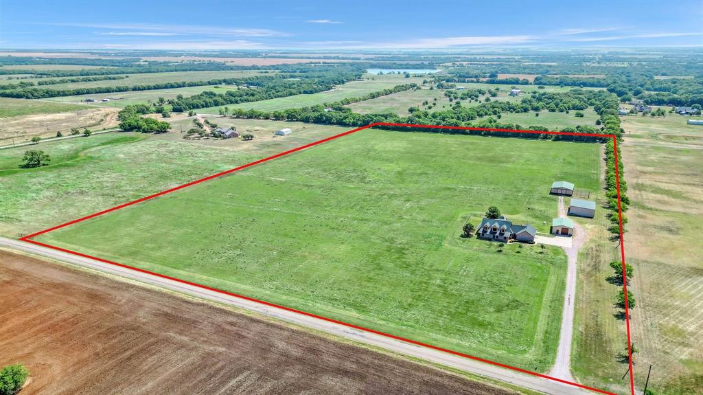 A superb 26.87-acre tract primed for development in the growing Gunter area. This property presents an excellent investment opportunity, ideal for immediate development or future plans. Situated in a rapidly expanding region, Gunter offers immense potential, making this parcel a prime piece of real estate. This property also boasts an exquisite home with a spacious living area, a wood-burning fireplace, an open kitchen and breakfast area, and a luxurious master bedroom with an ensuite bathroom. The office or guest room is conveniently serviced by a hall bath. Upstairs, you'll find two generously sized bedrooms and a wide-open game room, perfect for entertaining or relaxing with family and friends. The property offers an abundance of space and light, creating a warm and inviting atmosphere throughout. This home can also be sold with only the south half of the property that is approximately 13.5 ac.