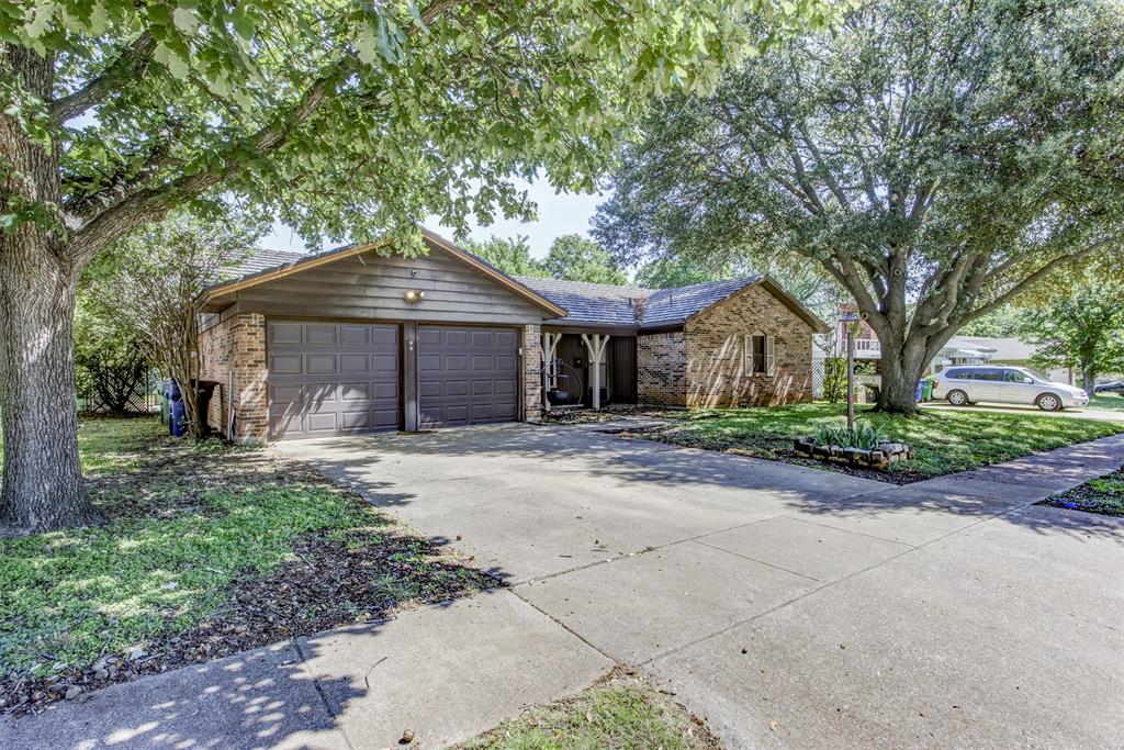 Welcome to this beautifully updated single-story home nestled in an established neighborhood, just minutes from shopping, dining and easy hwy access. Inside, you’ll find a thoughtfully renovated kitchen paired with updated flooring throughout, creating a fresh and cohesive feel.
The spacious living room features a charming brick fireplace, perfect for cozy evenings, and flows seamlessly into the adjacent breakfast area for easy, casual dining. The generously sized primary suite offers a walk-in closet and a private en suite bath, while two additional bedrooms and a full bath provide plenty of space for family or guests. Step outside to a backyard designed for both relaxation and entertaining. Enjoy your morning coffee on the large covered patio, unwind by the stone fire pit on cool evenings, and take advantage of the brick workshop—ideal for hobbies, storage, or creative projects. The fully fenced yard offers privacy and a secure space for pets or play. A big highlight of this home is the class 4 metal shake roof with 40 year warranty!