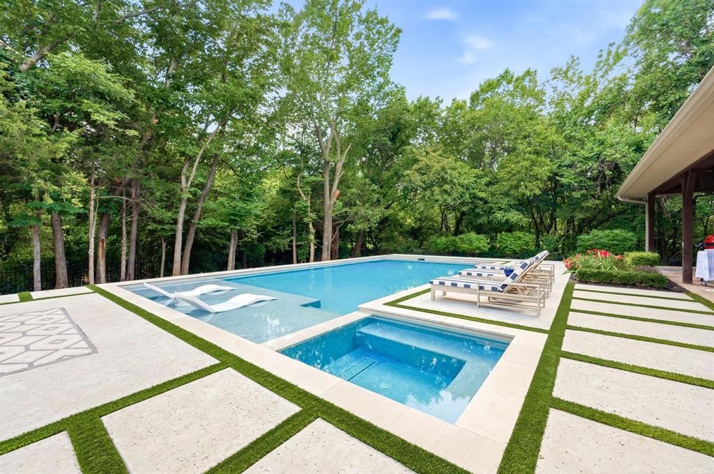 Some homes are defined by their finishes, others by their setting. This exceptional Southlake estate offers a rare combination of both, pairing distinctive architectural character with a premier half-acre homesite backing and siding to a private wooded greenbelt with only one side neighbor. Mature trees, neighborhood walking trails, proximity to Old Union Elementary, and being just minutes to Southlake Town Square create a setting that is both peaceful and connected.

Inside, custom brick accents, designer tile, and a vaulted great room with exposed wood beams, a stone fireplace, and built-in surround sound create warm, inviting living spaces. The remodeled open kitchen serves as the heart of the home, featuring a professional Fisher & Paykel gas range, built-in refrigerator and freezer, walk-in pantry, and generous prep and entertaining space.

The thoughtfully designed 4,552 SF floor plan includes a private primary suite overlooking the pool and greenbelt, plus two first-floor bedrooms on a separate wing. A mudroom with a built-in command desk flows into a functional laundry room, while abundant storage throughout enhances everyday living. Upstairs, a spacious game room with a wet bar and wine refrigerator is complemented by two ensuite bedrooms, creating a flexible 5-bed, 4-bath layout.

Recent improvements include a new roof (2024), two new HVAC systems (2025), and a third HVAC system replaced in 2023. An attached 2-car garage is paired with a separate oversized third bay with extended depth, ideal for a boat, workshop, golf cart, or additional storage.

Outdoor living centers around an expansive covered patio with built-in speakers, high-velocity cooling fans, and an outdoor grill overlooking a custom Claffey pool completed in May 2024. Distinctive architecture, significant capital improvements, and a sought-after greenbelt setting combine to offer unrivaled privacy, effortless entertaining, and a luxury outdoor lifestyle in Southlake.