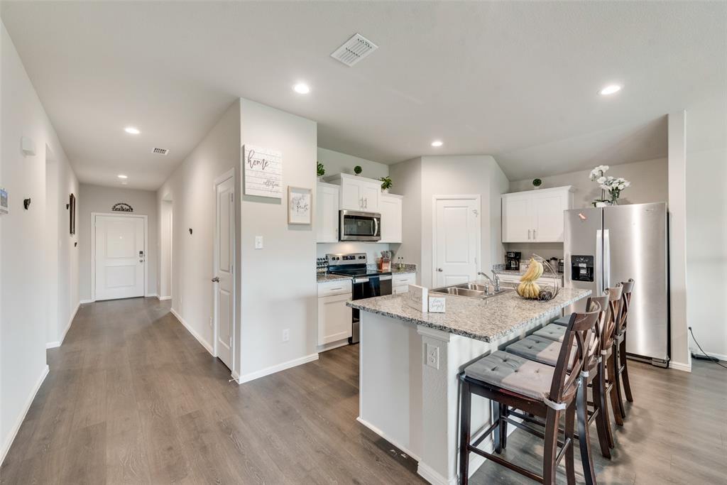 RENT-TO-OWN OPTION is available. Ask for more details. Rare oversized cul-de-sac lot — nearly double the backyard space of neighboring homes. There’s room for kids to run without feeling boxed in. Room for a playscape, soccer goals, birthday parties, and backyard memories that don’t fit on a postage-stamp lot. For those who love to host, the possibilities expand. Imagine a future pool, outdoor kitchen, firepit, or extended patio—with plenty of green space still left over. It’s the kind of lot that gives you long-term flexibility to build a backyard of your dreams. Inside, the home delivers the right balance of comfort and manageability. With four bedrooms and two baths, the layout feels spacious without being overwhelming. It still carries that modern, “new home” feel—clean lines, functional flow, and easy everyday living. The cul-de-sac setting adds another layer of appeal: less drive-by traffic, added privacy, and a quieter environment that enhances daily life. The Rivers Edge neighborhood offers a welcoming, well-kept atmosphere where pride of ownership shows. Sidewalks invite evening walks, and the kids ride bicycles up and down the street. Located near Highway 114 with convenient access to the North Fort Worth and Alliance corridor, you get suburban breathing room without sacrificing proximity to shopping, dining, and major employment hubs.