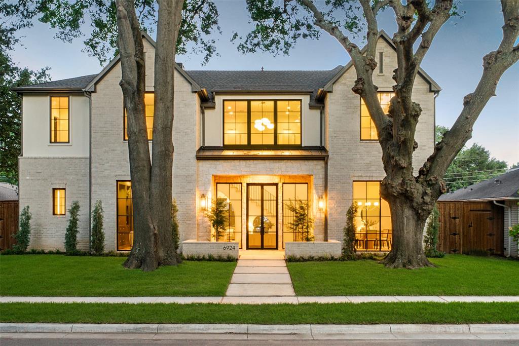 This brand-new home at 6924 Redstart Lane was built by Kedem on a quiet street lined with two huge old trees in the front yard, giving it instant charm and a welcoming presence. With its thoughtful design and quality details throughout, it feels like a fresh start in a home that’s ready for real life. Andersen windows and the striking two-story gray brick facade with black-framed windows bring in plenty of natural light and add a polished look that stands the test of time.
The kitchen is a standout with beautiful quartzite countertops, a large central island, extensive custom cabinetry, and Wolf and Sub-Zero appliances. It’s the kind of gourmet space that makes everyday cooking feel special and works just as well for hosting friends and family. You’ll also love the bright, open living areas featuring light wood flooring, coffered and vaulted ceilings, plus a formal dining area with an arched entryway and elegant chandelier.
Additional highlights include a dedicated office with extensive built-ins, a spacious primary suite, vaulted ceiling bedrooms, a custom built-in closet system, and beautiful bathrooms with features like glass-enclosed showers and a white built-in tub. Outside, the covered patio with light brick and wood-finish details offers a perfect spot to enjoy the fresh air on this peaceful lot.
Built by Kedem with care and modern standards in mind, this new construction delivers the peace of mind that comes with a home made from the ground up. Everything feels current, efficient, and ready for you to make it your own. If you’re looking for a quality new home in the Lakewood area with timeless character and modern luxury.