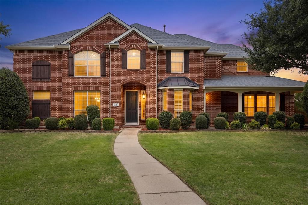 Welcome home to a beautifully maintained, original-owner residence tucked inside an established community known for its mature tree-lined entrance, picturesque pond, and peaceful atmosphere. Situated on a spacious 0.385-acre east-facing corner lot, this 5-bedroom, 4-bath home offers approximately 4,000 square feet and a thoughtfully designed layout built for real life, entertaining, and multi-generational flexibility. Tall ceilings, abundant natural light, and expansive living spaces create a warm, inviting feel throughout. The intentional floor plan offers both connection and privacy, with the primary suite privately positioned opposite the first-floor in-law suite featuring its own full bath, wall of windows, and convenient garage access. The converted third-car garage bay functions as an additional kitchen and prep space ideal for hosting, holiday cooking, outdoor-style cooking, wild game prep, or entertaining. Remaining garage space works well as a gym, workshop, or storage area and can be converted back. Upstairs features a game room, media room, built-in desk space, and Jack-and-Jill bath. Outside, enjoy peaceful mornings on the picturesque front porch overlooking the oversized lot. Located near parks, shopping, dining, major highways, and less than 10 miles from Lake Ray Hubbard for boating, fishing, kayaking, and lakeside recreation. Notable updates include HVAC and roof replaced in 2016, board-on-board fence installed in 2017, and water heater replaced in 2020. Additional highlights include a spacious walk-in laundry room, abundant storage throughout, and a flexible layout that adapts beautifully to changing seasons of life. Whether you're looking for room to host large gatherings, accommodate multi-generational living, create dedicated hobby or fitness spaces, or simply enjoy a little more breathing room while staying close to the city, this home delivers a rare balance of functionality, comfort, and lifestyle in an established setting.
