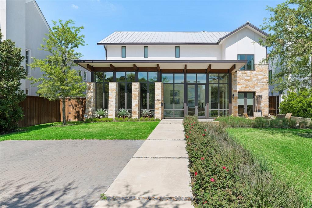 Exceptional contemporary residence in the heart of University Park, zoned to Hyer Elementary and situated on an oversized 72x167 lot with three-car garage. Showcasing sophisticated architecture and impeccable craftsmanship, this stunning home is defined by clean lines, warm Austin stone accents, and walls of glass that flood the home with natural light. Designed for both everyday living and effortless entertaining, the main level offers multiple living spaces, a formal dining room, private study, and a chef’s kitchen appointed with Sub-Zero, Wolf, and Bosch appliances. A striking temperature-controlled wine display serves as a dramatic focal point. Upstairs, the luxurious primary suite is thoughtfully positioned for privacy and tranquility, while spacious secondary bedrooms each feature ensuite baths. The third level offers exceptional flexibility and is currently utilized as a golf simulator with a full bath, easily transitioning into a media room, game room, fitness studio, or additional living space. Premium finishes including limestone, marble, and oak hardwoods create a timeless aesthetic. Expansive sliding glass doors connect the interior to the private backyard, featuring a covered patio with outdoor kitchen and resort-style pool, creating the ultimate indoor-outdoor lifestyle. Ideally located within one of Dallas’ most prestigious neighborhoods, this remarkable residence offers a rare opportunity to experience modern luxury in University Park.