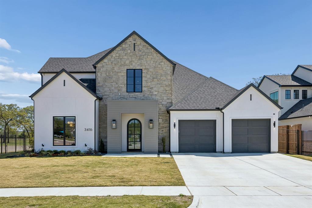 Step into this bespoke showpiece by V Patrick Gray Homes, nestled on a corner lot in the back of the new Ferguson subdivision and zoned to the  award-winning Carroll ISD. Designed with a perfect blend of elegance, comfort, and livability, this transitional gem offers a seamless balance of luxury and practicality. Spanning 4,213 sq ft with 4 bedrooms - 2 conveniently located first-floor - 4.1 baths and 2 Car Garage, this home is a true standout.
From the moment you enter, the rich hardwood floors and warm wood accents guide you through a space where every detail has been thoughtfully curated. At the heart of the home lies a chef’s kitchen outfitted with top-of-the-line Thermador appliances, custom cabinetry, and a spacious walk-in pantry—tailor-made for effortless entertaining. The inviting open-concept living area is anchored by a stunning designer fireplace, creating a cozy yet sophisticated ambiance. Whether hosting a gathering or enjoying everyday moments, this home has spaces designed for every occasion. In addition to spacious game room up are 2 beds with ensuite baths and a dedicated media room - perfect for movie nights or game-day celebrations. Step outside to discover a covered patio, gas fireplace, phantom screens and view of expansive greenbelt and fountain—ideal for al fresco dining with a view. The energy-efficient design and abundance of natural light throughout the home enhance its charm and functionality, providing a space that feels as good as it looks. The grand entry sets the tone for the serene retreats within, including the tranquil primary suite that offers a private sanctuary of modern sophistication. Designer finishes throughout elevate the home’s aesthetic, creating a refined yet welcoming atmosphere that will captivate you at every turn. This home isn’t just a place to live—it’s where memories are made. From impeccable craftsmanship to spaces designed with both style & comfort in mind, this property redefines modern living. Welcome home!