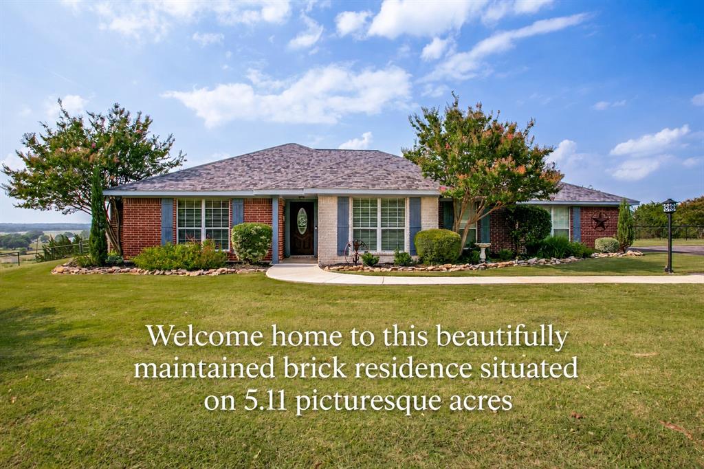 Welcome home to this beautifully maintained brick residence situated on over five picturesque acres, offering privacy, comfort, and convenience. Step inside to an inviting open-concept living area highlighted by an electric fireplace with a beautiful hearth. The kitchen is a true standout, featuring a center island, stainless steel appliances, granite countertops, and a spacious pantry. Updated luxury vinyl plank flooring flows throughout the main living areas, complemented by new carpet in the bedrooms. A formal dining room at the front of the home offers versatility and can easily be used as a playroom, home office, or flex space to suit your lifestyle. The remote primary suite provides a peaceful retreat with a large walk-in shower, dual sinks, and a generous walk-in closet. Enjoy outdoor living year-round on the expansive covered patio, overlooking the fully cross-fenced property—ideal for animals or hobby farming. Additional features include a 16x16 workshop with electricity and a private well to water the property, keeping it lush and green. Located just minutes from the HEB shopping area, you’ll enjoy quick access to dining, entertainment, and everyday conveniences. Residents of Bentwater on Lake Granbury have access to a community park, ponds, and a clubhouse available for private events or community gatherings. Boat dock slips are also available for lease, allowing you to fully embrace the Lake Granbury lifestyle. This exceptional property offers space, functionality, and a vibrant community—an opportunity not to be missed.