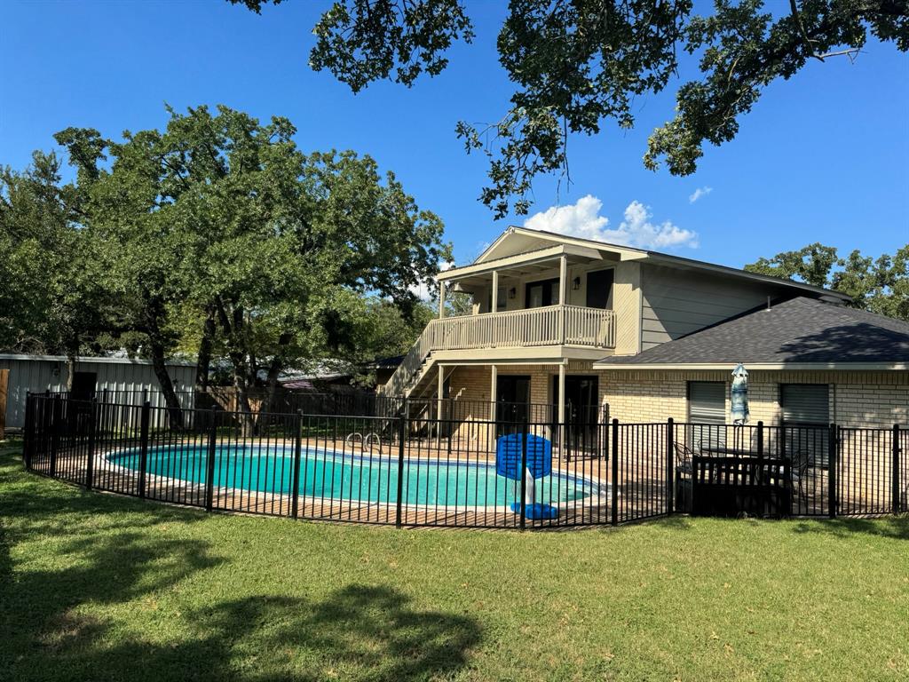 Your Ideal Haven for retirement Living
Discover comfort, tranquility, and space for cherished family moments at this beautiful 5-bedroom, 4-bathroom home in the quiet Western Hills neighborhood of Mineral Wells. This property is thoughtfully designed for those seeking a peaceful retreat close to amenities, perfect for retirees and grandparents. Convenient Single-Level Living (with a additional upstairs suite!): The primary bedroom is located on the main level for ease of access and single-level living. The home also features an upstairs suite with a separate entrance, perfect for visiting family, live-in help, or a private office-hobby space. The property is situated on an beautifully treed interior lot with a privacy fence, offering a secure environment for peaceful living. The practical floor plan and features like built-in cabinets in the utility room make daily tasks simple and convenient.
Low Maintenance, High Comfort: Enjoy a cozy fireplace with stone accents, an open floor plan, and laminate flooring for easy maintenance and a warm ambiance, ideal for relaxing evenings. Outdoor Enjoyment Made Easy: Step outside to a private, fenced backyard featuring an immaculate in-ground pool. This space offers a refreshing escape and a wonderful spot for entertaining grandchildren, with minimal upkeep required.
Proximity to Healthcare: Located on the west side of Mineral Wells, the home offers easy access to the local hospital and other essential amenities, providing peace of mind. Did I mention, No HOA Fees!
This charming ranch-style home in a quiet, friendly community is the perfect setting for your next chapter, offering comfort, function, and a lovely backdrop for making lasting family memories.
View the virtual tour or schedule a private showing to experience this exceptional property in person.

Buyer to verify all information independently.