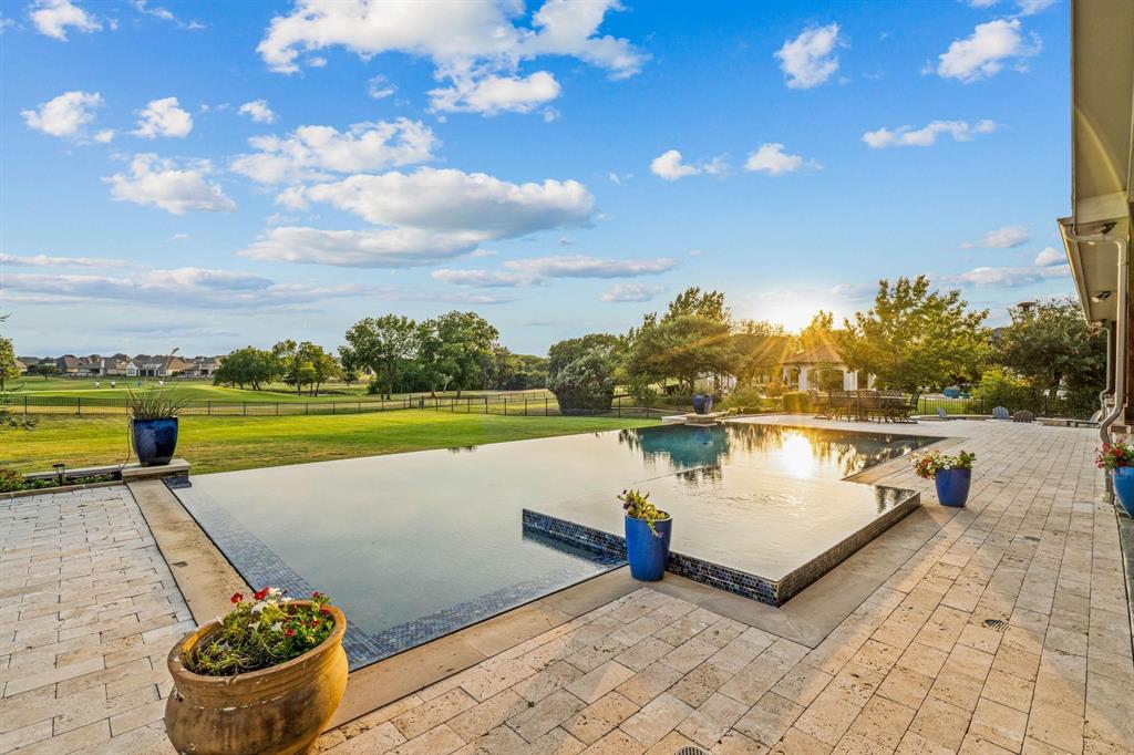 MILLION DOLLAR VIEW!  Inside you’ll find an EXQUISITE HOME with EUROPEAN INFLUENCES and MODERNIZED ESSENTIALS sitting on a 1.18 ACRE overlooking the 14th GREEN of GENTLE CREEK GOLF COURSE. With LAKE VIEWS and MESMERIZING SUNSETS this resort-like backyard includes over 1000 sq ft of TRAVERTINE DECKING and a one of a kind INFINITY-EDGE POOL, still leaving plenty of space to add a casita, putting green or more.
Spacious 6 Bedroom, 5.5 bathroom home with downstairs GAME ROOM, MEDIA ROOM, primary and secondary bedroom, and LARGE PRIVATE OFFICE  plus three additional secondary bedrooms upstairs. EXPANSIVE LIVING SPACES boast SOARING CEILING and an ABUNDANCE OF NATURAL-LIGHT. CULINARY ENTHUSIAST rejoice with top-of-the-line kitchen appliances and a huge walk-in pantry, a seamless flow between indoor and outdoor spaces and 15-ft sliding doors from the game room to pool area. 
COZY FIRE PIT and PRIVATE SPORTS COURT for your enjoyment and exercise. 
Recently updated painting throughout.