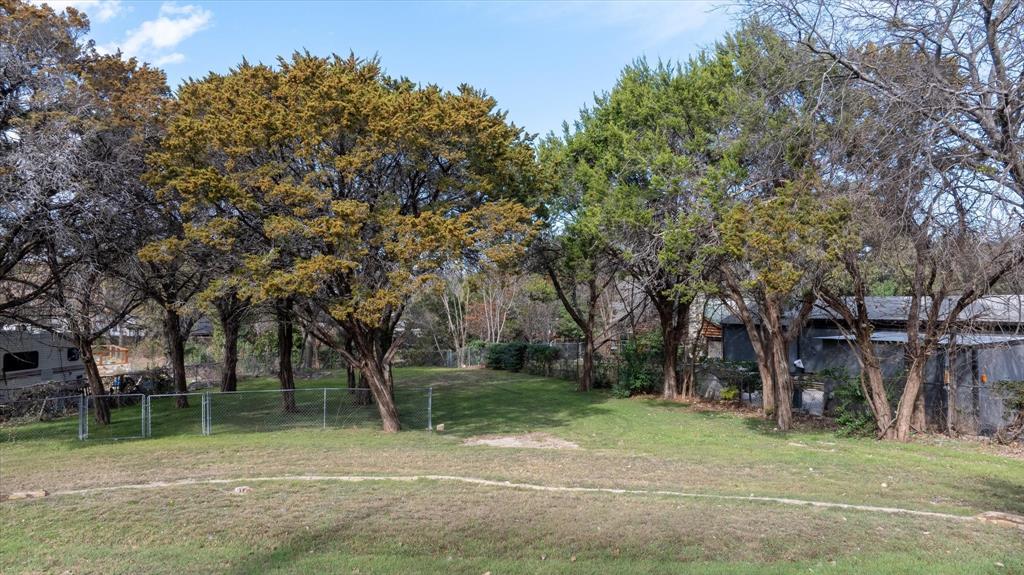 Waterfront lot on Lake Granbury offering lake view and direct access to the water. This property provides the perfect opportunity to build your custom lake home or weekend retreat. Enjoy peaceful surroundings, mature trees, and the relaxed lake lifestyle just minutes from historic downtown Granbury, dining, shopping, and entertainment.