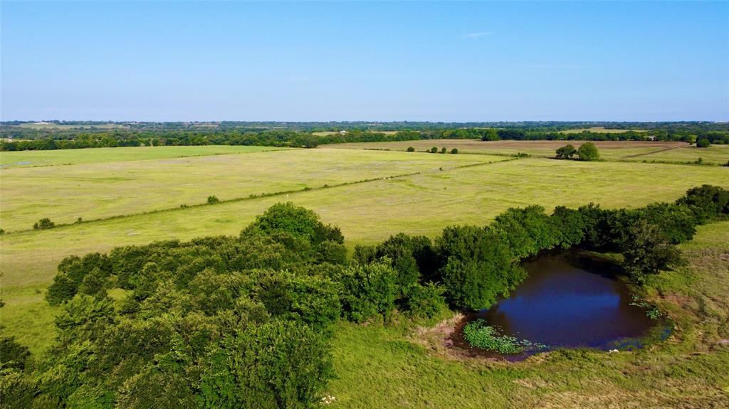 Just 10 minutes from Stephenville, this Bunyan Green's Creek area farm is 276ac of sandy loam soils ready for a new operator to maximize production and profits. Anchoring the ranch is a 2023 Valley four tower center pivot watering a total of 51.5ac at a flow of 5.82gpm per ac. The center pivot is fed by two wells drilled in 2023 and powered by new 3 phase electricity brought in from the west side of the ranch. Currently there is approximately 105ac of coastal and-or kleingrass, 51.5ac of irrigated cropland, and 87ac of dry cropland. Bisecting the ranch is 32ac of wooded riparian area with a seasonal creek that fills three ponds along it's path for livestock water. The headquarters is located near the entrance in the NE corner and contains a 1980's ranch house that has had tenants in it until recently, shop, barn, equipment shed, and small working pens fed by a centrally located trap. The farm has access from CR 385 on the NE side, and CR 373 on the west side, offering quick access to Dublin, Stephenville, and Lingleville. Overall this is a highly productive stock farm with almost 100% productive, grazeable acres. The information contained herein has been gathered from sources deemed reliable; however, the Mock Ranches Group, Keller Williams Realty and its associates, members, agents and employees cannot guarantee the accuracy of such information. No representation is made as to the possible investment value or type of use. Prospective buyers are urged to verify all information to their satisfaction and consult with their tax and legal advisors before making a final determination.
Real Estate buyers are hereby notified that properties in Texas are subject to many forces and impacts, natural and unnatural; including, but not limited to weather events, environmental issues, disease, invasive species, illegal trespassing, previous owner actions, actions by neighbors and government actions. Prospective buyers should investigate any concerns.