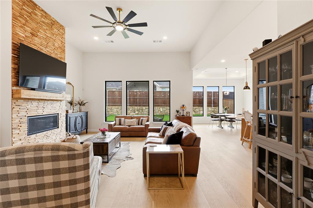 **PRICED TO SELL** DON’T MISS YOUR CHANCE TO OWN A BEAUTIFUL HOME IN SONOMA VERDE! Welcome to 1721 Salvatore Lane, a beautifully maintained CastleRock home nestled in the highly sought-after Sonoma Verde community and zoned to the award-winning Rockwall ISD. Spanning nearly 2,800 square feet, this thoughtfully designed floor plan features 3 spacious bedrooms, 2.5 bathrooms, and a versatile flex room that can easily serve as a home office, playroom, media room, or 4th bedroom. Inside, light hardwood floors, soaring ceilings, upgraded black-trimmed windows, and crisp designer finishes create a bright, modern atmosphere throughout. The gourmet kitchen is truly the heart of the home, showcasing rich cabinetry, glass-front accents, designer lighting, a farmhouse sink, and an oversized island that seamlessly connects the kitchen, dining, and living spaces—making it perfect for entertaining. The inviting living room centers around a stunning fireplace with a custom wood surround, while the private primary suite offers a true retreat with room for a sitting area, abundant natural light, and a spa-like feel. Every detail reflects quality craftsmanship and pride of ownership. Offering the perfect blend of luxury, comfort, and resort-style living, this home is ideal for buyers seeking top-rated schools, exceptional amenities, and a peaceful neighborhood setting. From the moment you arrive, you'll be captivated by the stunning stone elevation, manicured landscaping, and oversized covered front porch, perfect for morning coffee or relaxing Texas evenings. Sonoma Verde offers residents resort-style amenities, walking trails, community events, pools, parks, and more. Beautifully built, meticulously cared for, and move-in ready, this is the one you've been waiting for.