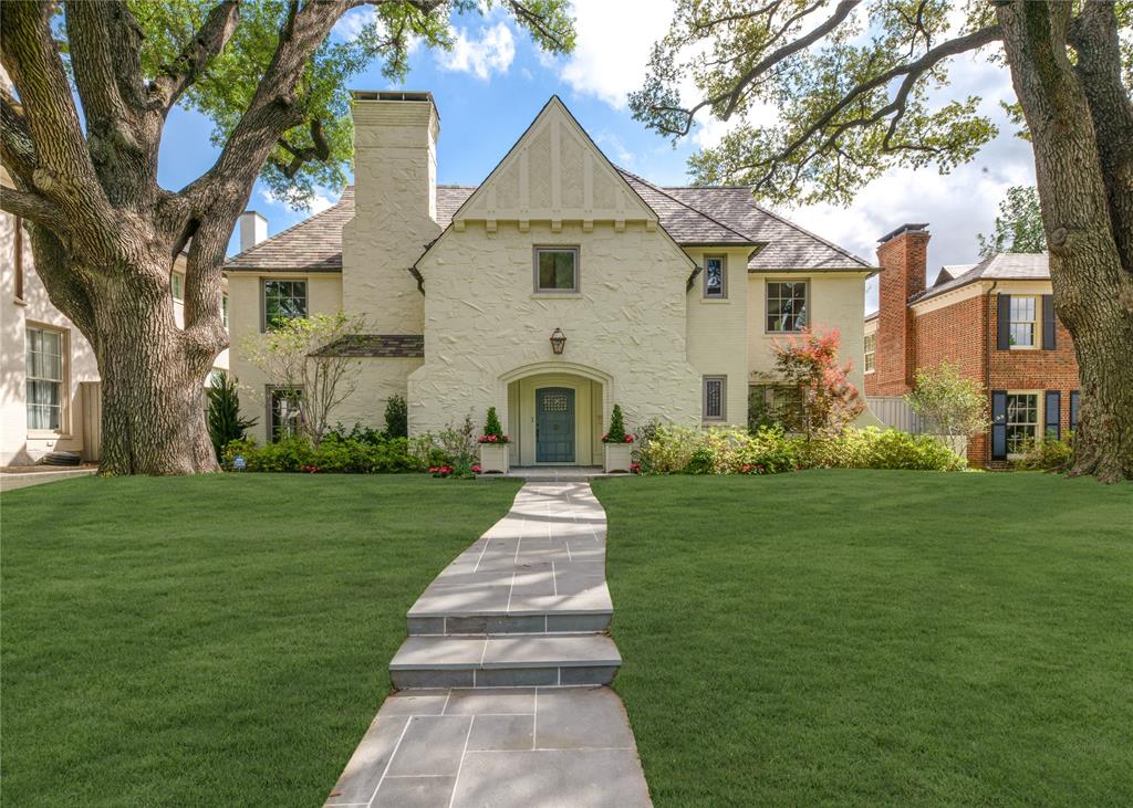 A rare Highland Park residence by acclaimed Dallas architect Hal Yoakum. While many homes are simply renovated, this residence has been thoughtfully transformed with a level of intention that sets it apart from anything else on the market. Situated on an oversized 75 x 168 (.29-acre) lot along one of Highland Park’s most desirable, tree-lined streets, the home makes an immediate impression. A Pennsylvania bluestone pathway leads through newly redesigned landscaping to an inviting entry, framed by fresh Sierra Pacific windows. Inside, every detail reflects thoughtful craftsmanship. New and refinished hardwood floors, custom leaded glass, and a completely reimagined kitchen anchored by natural stone and custom cabinetry with soft close drawers create modern necessities while preserving the Tudor craftsmanship. A premium appliance package featuring Sub-Zero, Wolf, and Bosch offers exceptional performance and convenience for everyday living. Distinctive interiors including a lacquered living room, hand-painted silk dining room wallpaper, and a trellis-accented den showcase thoughtful design and meticulous execution throughout. Upstairs, the primary suite serves as a true retreat, featuring wood-beam ceilings, a spa-inspired marble bath with painted rift white oak cabinetry, and serene views of the surrounding tree canopy offering a sense of privacy just moments from Highland Park Village. Each secondary bedroom is ensuite, with fully renovated baths finished in floor-to-ceiling marble. A versatile fifth bedroom functions beautifully as a playroom or private guest suite, complete with its own wet bar. An elevator a coveted amenity adds both convenience and sophistication, seamlessly connecting both levels. Whether bringing in shopping, moving suitcases from the second to the first floor, or planning for long-term ease of living, it enhances the homes practicality. This is a rare opportunity to own a truly exceptional, fully transformed home in the heart of Highland Park.