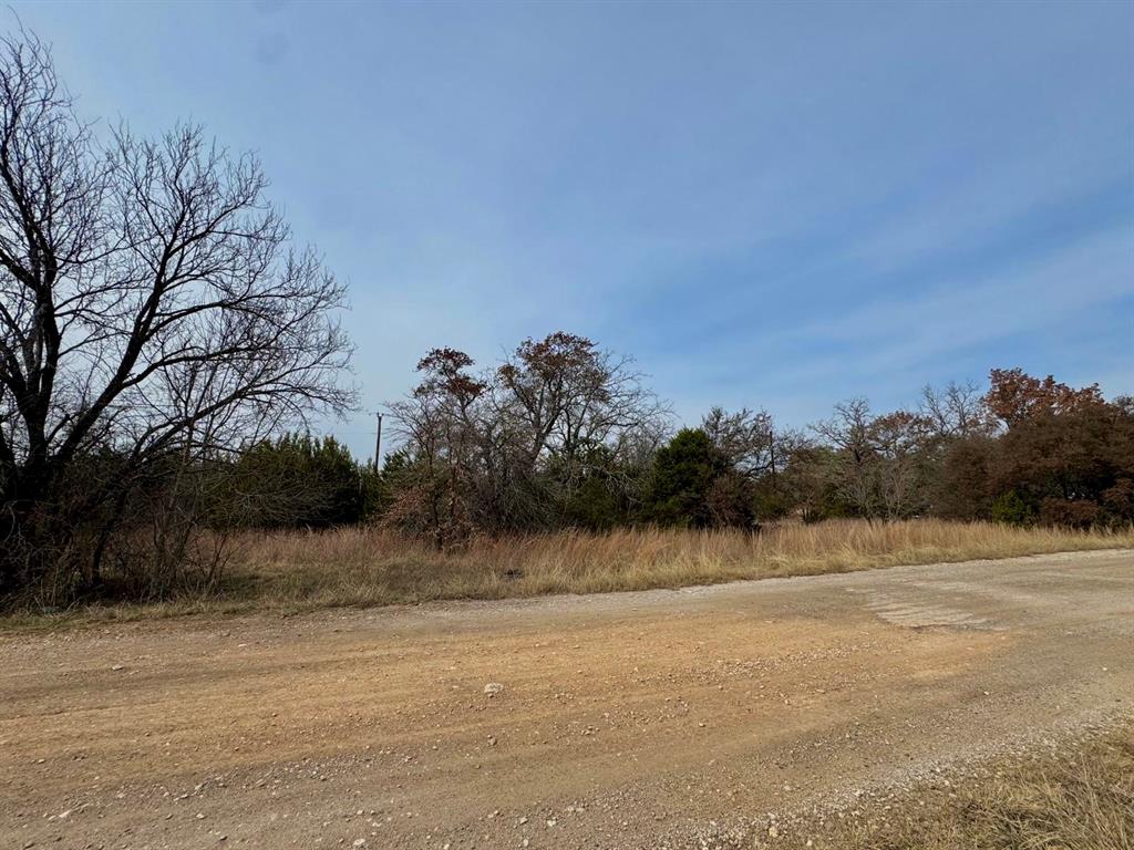 This is a rare opportunity to own four side-by-side vacant lots in the established community of Lake Granbury Harbor, all being sold together as a package. Build four homes or create one expansive homesite with plenty of room to spread out. Each lot has an HOA fee of just $48 (totaling $192 for all four), offering an affordable option in a lakeside community. One tax ID includes three lots with assigned addresses of 5822, 5824, and 5826 Arkansas Trail, plus a separate tax ID for 5820 Arkansas Trail. Located just minutes from Lake Granbury, you’ll enjoy convenient access to boating, fishing, and waterfront recreation. Historic Downtown Granbury, local shopping, and dining are nearby. The property is within Granbury ISD and offers easy access to TX-171 Loop and US-377, making commuting to Weatherford, Cleburne, or Fort Worth simple and convenient. Two legal descriptions for this listing: LOT: 156, 157 & 158 BLK: 1 SUBD: LAKE GRANBURY HBR SEC A & LOT: 159 BLK: 1 SUBD: LAKE GRANBURY HBR SEC A.