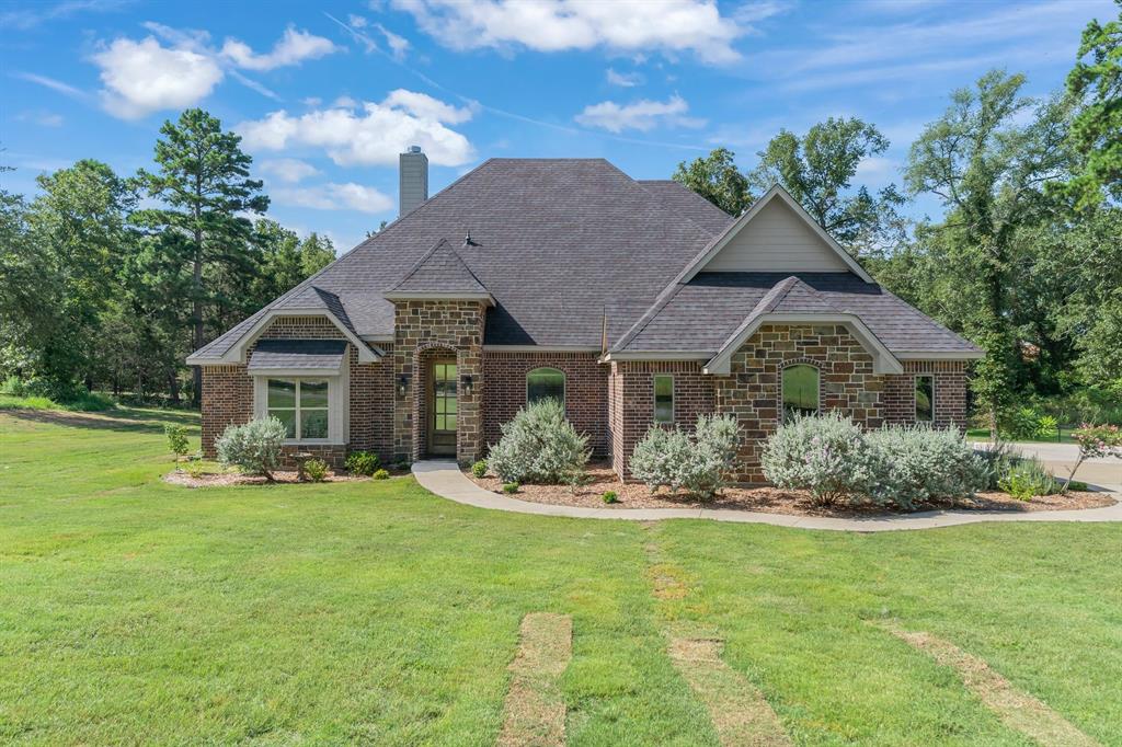 Built by a homebuilder for his own family, this gorgeous open concept home has great details. In the kitchen, you'll find expansive counter space, gas appliances, and a chef's dream pantry with counter depth shelving. The kitchen overlooks the large living and dining areas accented by the floor to ceiling stone fireplace. The house has a large dining room area as well as a separate breakfast space. The large master bedroom has an oversized L-shaped closet, walk-in shower with multiple shower heads, and a deep soaker tub. And the storage! Pass through the laundry room to an extra storage area and there's walk-in attic access on the second floor with attic flooring that goes around two corners and just keeps going. Two of the secondary bedrooms are on the first floor with a Jack and Jill bathroom. And the second floor has a large space with full bath currently used as a bedroom but could also be a game room or flex space of your choosing. Outside you'll find a second wood burning fireplace on the covered patio. The oversized yard backs up to 5-acres of private, wooded land. And the expanded driveway provides extra parking. Come see this quality custom home on a cul-de-sac in Tuscany Park Estates!