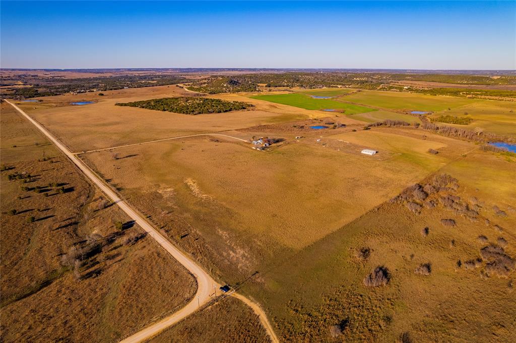Welcome to Dinner Hill Ranch, your dream property with over 260 acres of Texas ranch land! 27 acre Dinner Hill sits in the middle of the property perched 105 feet above the ranch offering exceptional 360 degree panoramic views of Bosque County & the North Bosque Watershed. The ranch is fully fenced along the perimeter, featuring both 5-string & 7-string barbed wire fencing. With several cross-fenced pastures, working cattle pens, & 4 ponds scattered across the property, the ranch is set up great for livestock & wildlife. A gated entrance & gravel road lead to the 3 bed 2 bath residence & barn which is serviced by a 550' deep 2nd Trinity water well. A secondary livestock water well is on-site. Dinner Hill was once mined for gold (unsuccessfully) & the mine chambers still exist. Whether you are seeking a livestock operation, hunter's haven, or retreat away from the city, this ranch has it all. Located just off FM 927, one of Texas' most scenic stretches of highway!