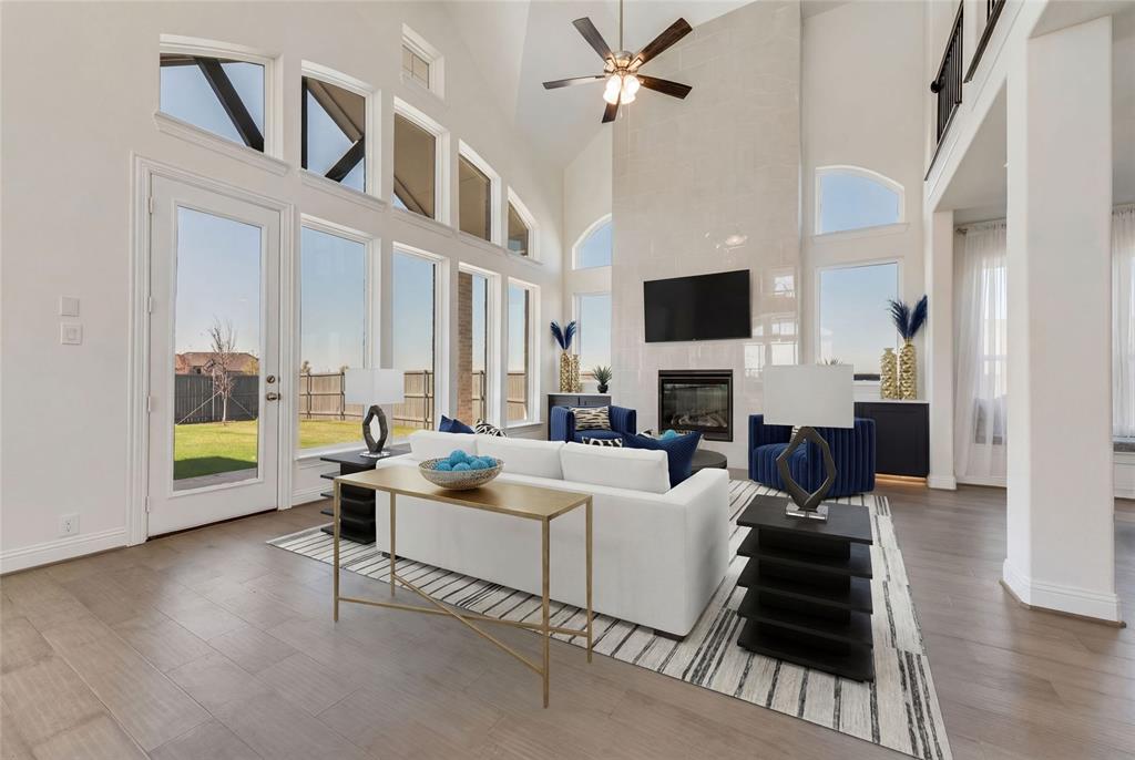 New Grand Home in super fun Prairie Ridge with neighborhood pool, miles of trails, spectacular playground & parks! JUST Completed - walk to trail system, parks & Pool. East facing homesite. Modern finishes with full oak staircase w wrought iron spindles, wood floors, 8 ft doors, rocker switches & thick door casing & trim. Vaulted family room has 2 story tiled fireplace that is open to covered back patio ready to entertain. Downstairs Media Room or Den wired for surround sound & flat screen TV. Downstairs Guest Bedroom or a Private Home Office. Upstairs gameroom for the kids with 3 additional bedrooms. Large Chef's kitchen has granite slab tops, white Shaker cabinets, stainless steel appliances, gas cooktop, full bowl sink & island for family get togethers. Primary Bath has a free standing garden tub, separate his & her vanities w rectangle sinks & glass enclosed tiled shower. Security & Sprinkler systems. Energy Star Partner features include radiant barrier roof decking & R38 ceiling insulation for low energy bills!