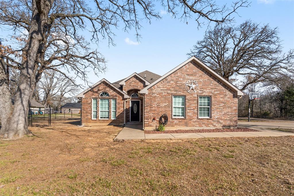 Welcome to this beautifully maintained 3BR 2 BA brick home nestled in a desirable gated community offering comfort and security. From the moment you arrive you will appreciate the inviting presence that makes this home stand out. Inside you will find the thoughtfully designed floor plan perfect for everyday living. The light filled living area features an open layout that flows seamlessly into the dining space and kitchen creating the ideal environment for gatherings. The kitchen offers ample real wood cabinetry, generous counter space with granite countertops and a island. The primary suite provides a relaxing retreat complete with an ensuite bathroom with a walk in closet. Two additional bedrooms with a full bath to share and a flex room for an office or another bedroom. Step outside in the fenced back yard and covered patio to drink your morning coffee or watch the subset. Jump on your golfcart and roll down to the park to fish or swim or swim in the pool. They also have a playground for the kiddos or a boat ramp to launch your boat or jet ski. Conveniently situated near shopping, dining and major roadways this home combines comfort, convenience and peace of mind. Dont miss the opportunity to make this charming property your own.