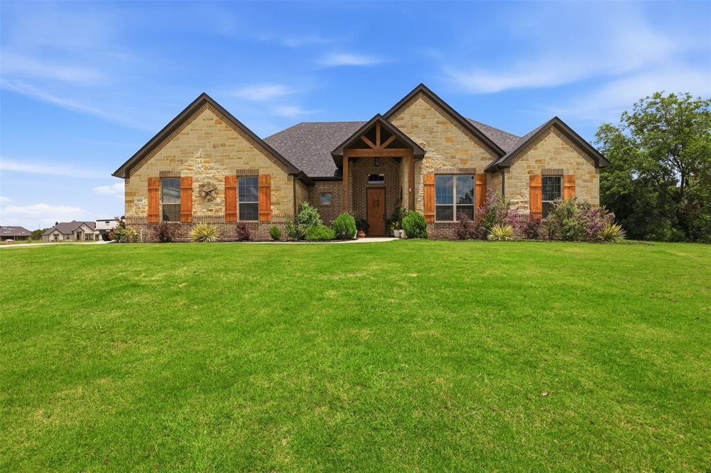 Welcome to your dream retreat! Nestled on a sprawling, private lot of over an acre, this meticulously maintained 2022 craftsmen-style ranch offers the perfect blend of modern elegance and tranquil country living. Step through the inviting covered front porch into a light-filled, open-concept floor plan with soaring ceilings with a spacious living area flowing into the kitchen. The thoughtful split-bedroom layout ensures maximum privacy. The primary suite features a custom-tiled walk in shower with a spacious walk in closet. Two additional well-appointed bedrooms are tucked away on the opposite side of the home with a private dedicated office.  Fully insulated with foam insulation with solid core doors, this home provides exceptional energy efficiency.