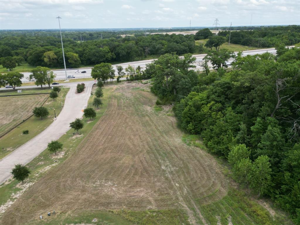 Discover this outstanding 1-acre parcel of potential commercial land, strategically positioned with direct frontage on both US Highway 75 and Gateway Dr- Stone Creek Dr. Offering unparalleled visibility and accessibility—just off the exit ramp—this high-traffic location is ideal for a wide range of commercial developments. The property boasts a scenic pond view and is uniquely situated adjacent to the 10th green of a popular golf course, providing a picturesque setting that enhances its appeal for potential businesses. Variety of commercial uses, this site is well-suited for: Restaurants and cafes, professional office spaces, medical or wellness centers, retail establishments, and more. Key features include: All utilities available at the street, high visibility and convenient access, level, vacant land ready for immediate development. Lots already subdivided, but can be purchased as a whole. Whether you’re looking to establish a flagship location or expand your commercial portfolio, this is a rare opportunity to secure premium land in a growing area. Don’t miss out on developing in one of the region’s most desirable commercial corridors.