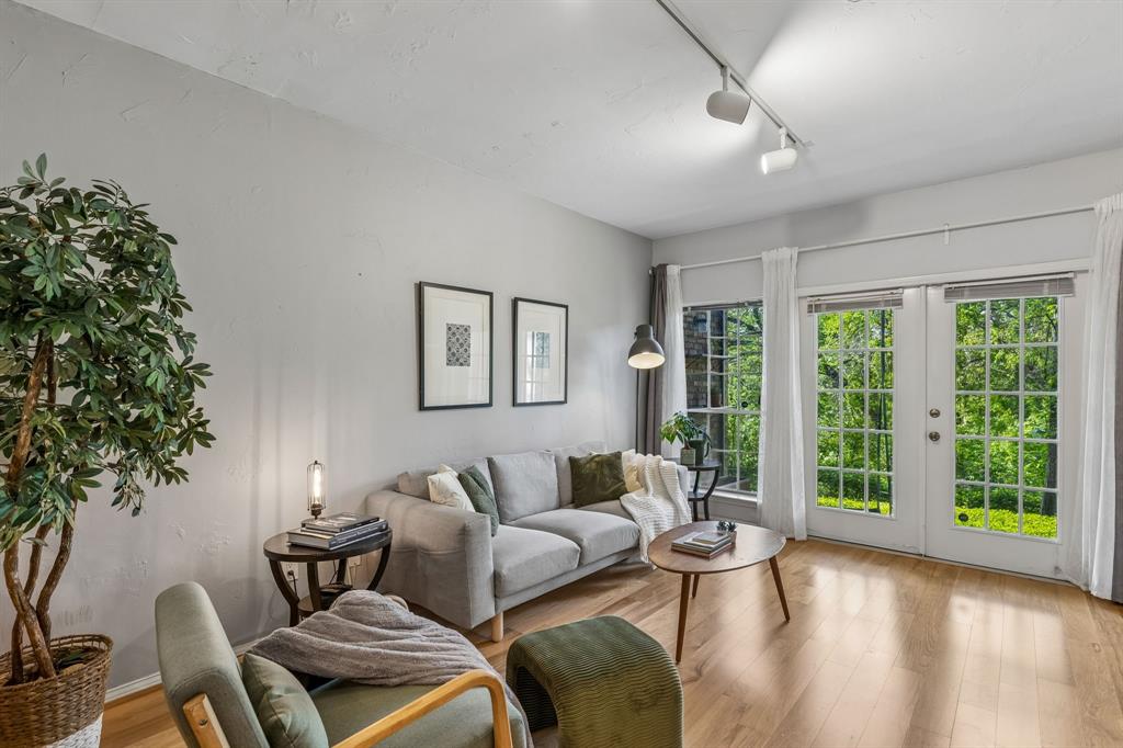 Stylish, light-filled, and backing to a peaceful greenbelt, this first-floor condo checks all the boxes. Featuring 2 bedrooms and 2 bathrooms, the home offers an open layout with warm wood floors, a spacious kitchen with granite countertops, stainless steel appliances, and a large island perfect for gathering. The real standout? The serene, tree-lined views from your private patio, rare for condo living and perfect for morning coffee or winding down in the evening. With generously sized bedrooms, updated finishes, and a location that puts you minutes from North Dallas, Addison, and major highways, this is an easy choice for anyone looking for comfort, convenience, and a little bit of nature right outside their door. Inside, you’ll find warm wood flooring throughout the main living areas, an open-concept layout, and abundant natural light that creates an inviting, airy feel. The kitchen features granite countertops, stainless steel appliances, ample cabinetry, and a large island that seamlessly connects to the living and dining spaces. Perfect for everyday living and entertaining.