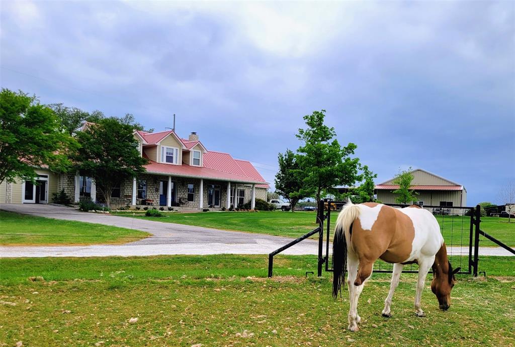 Have It All—Luxury Living, Horse Facilities, & Lake Access with deeded boat slip in the coveted Bentwater on Lake Granbury Estates!

Experience the best of country living with modern convenience in this fully updated custom, 3-bedroom, 3+ bath, wide-open living room, dining and kitchen space, horse-friendly estate, complete with a deeded boat slip at the private Bentwater marina. There is also a lovely sunroom with low E windows overlooking the backyard & what has to be, one of the oldest oak trees in Granbury!

Built with insulated concrete block construction for exceptional energy efficiency, durability, & peace of mind, this home has been thoughtfully upgraded with a new metal roof, zoned HVAC systems, and zoned water heaters. Inside, you'll find spacious living areas, a huge primary suite with an giant walk-in closet, an extra-large pantry with deep shelving, & two walk-in attic spaces providing abundant storage.

Equestrians & hobbyists will appreciate the impressive 2,000+ square-foot outbuilding featuring an office with a half bath and nearby loafing sheds. The property is fenced with quality electrobraid & pole fencing, includes multiple gates for easy access, & offers beautiful coastal pastures for regular rotations.

Additional features include:
Water well & electricity available in multiple locations across the property
Large, well-maintained pastures ready for horses
Energy-efficient insulated concrete block construction with new metal roof
Zoned HVAC & water heater systems
Extensive storage throughout

Ideally located on the Fort Worth side of Granbury, this exceptional property offers convenient access to shopping, dining, & the charm of the Historic Granbury Square while maintaining the privacy & freedom of country living. A rare opportunity to enjoy horses, boating, and modern comfort all in one remarkable property.
Info is deemed reliable, but should be verified. Contact sellers at 903-348-4408 for showing appointment.