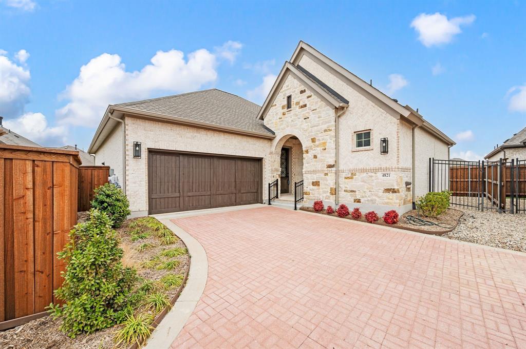 **The best value in the community!** Don't miss this opportunity to own one of the best-priced homes in this highly desirable 55+ active adult community, where neighbors become friends and every day feels like a retreat. Perfectly situated across from a beautiful neighborhood park, you'll love stepping out your front door for morning walks, community gatherings, or simply enjoying the peaceful setting. Inside, this barely lived-in 3-bedroom, 2-bath home offers the ideal blend of comfort, style, and low-maintenance living. The light-filled open floor plan was designed for easy entertaining, featuring soaring ceilings, a spacious Great Room, and a seamless flow between the living, dining, and kitchen areas. A stunning fireplace creates a warm focal point, while oversized windows and upgraded sliding glass doors open to an expansive covered patio—perfect for morning coffee, evening cocktails, or hosting family and friends for a Texas-sized BBQ. At the heart of the home, the beautifully appointed white kitchen shines with quartz countertops, abundant cabinetry, a large center island, and generous prep space, making everyday living as enjoyable as entertaining. The private Owner's Retreat offers a peaceful escape with a spacious walk-in closet and a spa-inspired bath featuring upgraded designer tile. A flexible enclosed study can easily serve as a home office, hobby room, or third bedroom, while the separate guest suite provides comfort and privacy for visiting family and friends. Thoughtful extras—including a large walk-in linen closet, mudroom, abundant storage, and an easy-care backyard—make daily life effortless. If you've been waiting for the perfect combination of value, location, and lifestyle, this move-in-ready home delivers it all. Enjoy resort-style amenities, an active social calendar, and the ease of low-maintenance living in one of the area's most sought-after 55+ communities. Skip the construction timeline, avoid the added expense of builder upgrades.