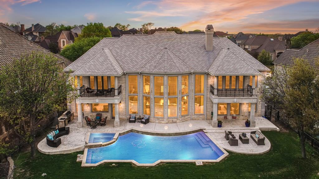 Welcome to your dream luxury golf course home! This STUNNING one of a kind property features a stone exterior and a spectacular drive up appeal. Step inside and be greeted by soaring ceilings and incredible views to the golf course. The spacious and inviting layout is perfect for entertaining with plenty of room for all. The home's entertainment potential is further elevated by the amazing wet bar, perfect for hosting guests. And when it's time to unwind, the media room offers a cozy retreat for movie nights or gaming sessions. This home features 2 Primary Bedroom Suites, plus 3 additional bedrooms and a home office. The upstairs Primary Bedroom features a private gym. The outdoor space is equally impressive with the pool as the centerpiece of the backyard oasis, providing the perfect setting for summer afternoons spent soaking up the sun. The 4-car garage provides ample space for all your vehicles & storage needs.
