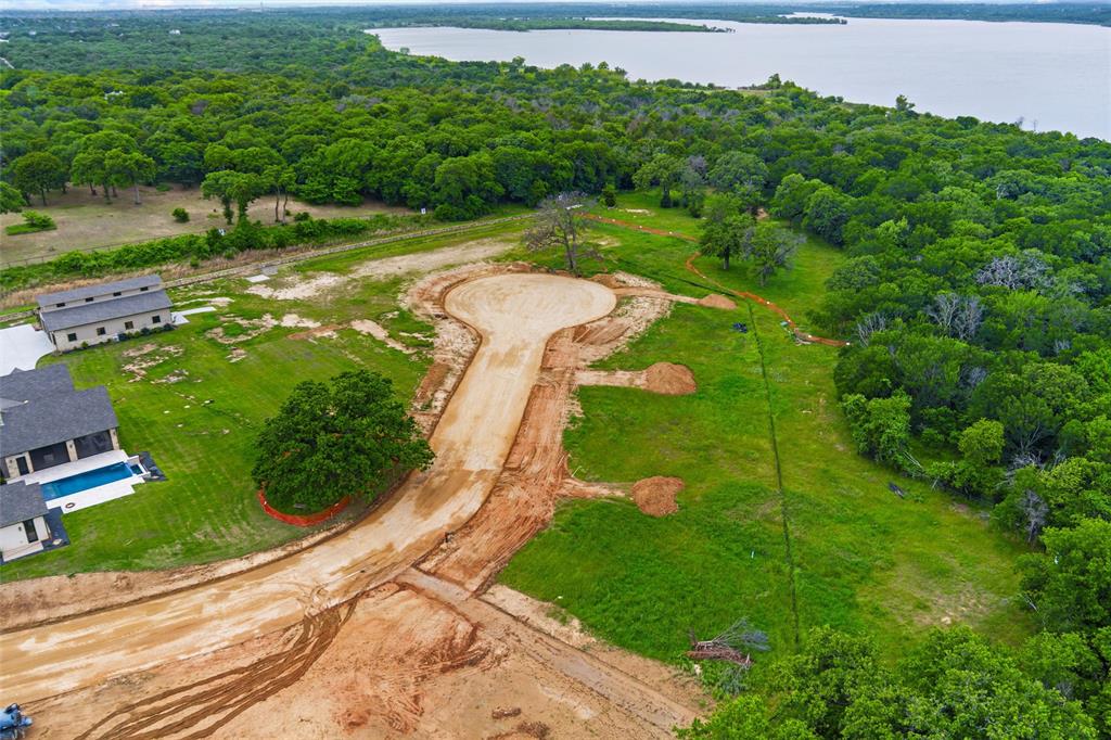 Discover the pinnacle of luxury living at The Hideaway, Southlake’s most exclusive private enclave. This is your rare opportunity to build a bespoke estate with your favorite builder on expansive 1-acre lots in one of North Texas’ most prestigious communities. Nestled just 18 minutes from DFW International Airport, The Hideaway offers an unmatched combination of serene privacy and effortless convenience. Every homesite provides open enrollment to the highly acclaimed Carroll Independent School District, renowned for its exceptional academics and extracurricular programs — making it an ideal setting for families who value both lifestyle and legacy. Envision your dream residence: fully custom homes beginning at 5,000 square feet, thoughtfully designed by your choice of elite local builders or your personal architect. These generous lots provide the space and flexibility to create something truly extraordinary — whether you desire a resort-style pool and spa, expansive outdoor living areas, a private guest suite, or sophisticated smart-home technology. Residents enjoy premium infrastructure, including city water, high-speed Spectrum fiber internet, and reliable Tri-County Electric Cooperative service for both electricity and natural gas. Lot 7 stands out as particularly special, backing directly to protected U.S. Army Corps of Engineers land along Lake Grapevine. This rare adjacency delivers breathtaking tranquility, lush green views, and a sense of seclusion rarely found in today’s developed landscape. The Hideaway is more than a place to live — it is a lasting legacy. A sophisticated sanctuary where discerning families can create timeless memories surrounded by natural beauty, world-class amenities, and unparalleled convenience to everything Dallas-Fort Worth has to offer. Lot delivery is scheduled for summer 2026. Contact us today to schedule a private tour and begin crafting the custom estate you’ve always envisioned.