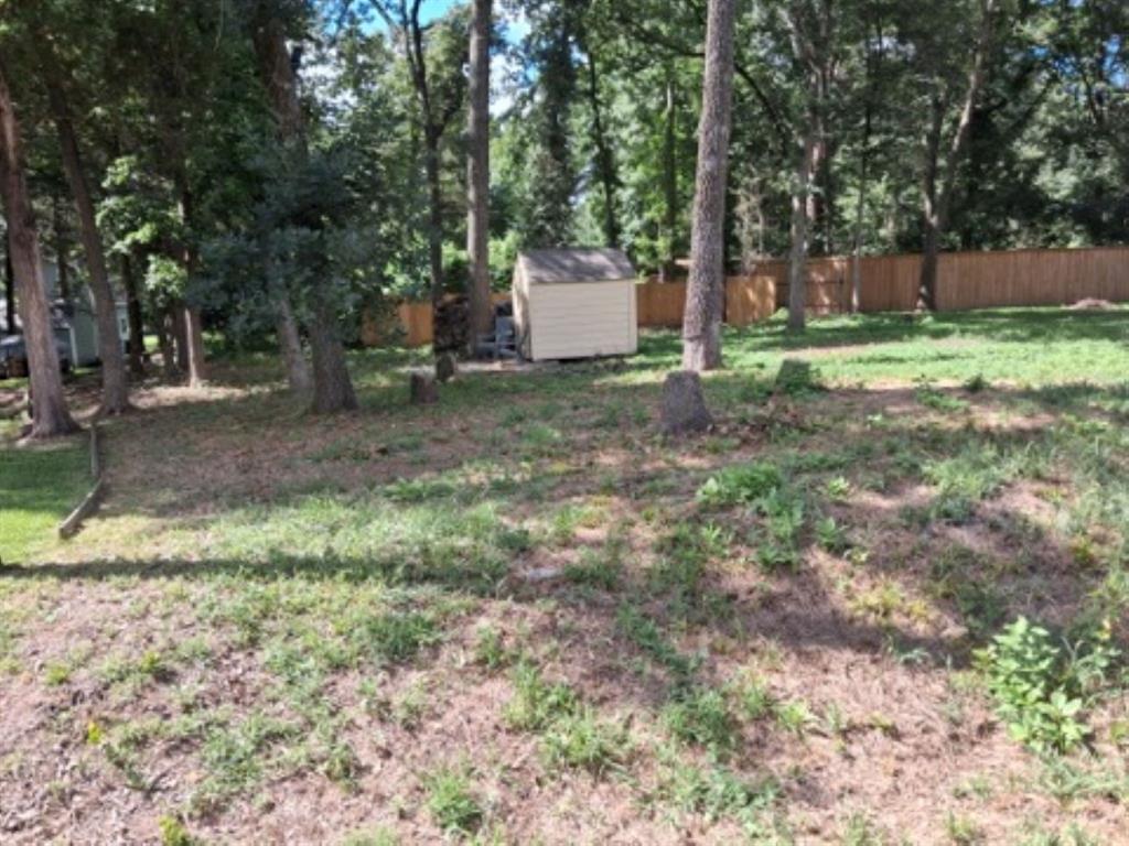 Water View lot in the gated community of Hickory Hills on the 365 acre spring fed Callender Lake.  This 0.192 acre lot has been cleared and has a small storage building on the lot.  The lot is about 78x 105 feet and has a rectangular shape.  This lot would be great for your RV, mobile home, or site built home.  Mobile homes and site built homes must be 600 sq. feet or larger.  RV's and Mobile homes can not be older than 10 years old when brought into the community and must be approved by the ACC committee.  Electricity and water are at the street and ready for install.  A septic system must be installed if you build or bring in a home.   Lot is a short walk to the water and the public swim area.  This gated community has a community pool, children's park, Fishing pier, restroom and shower facility, pavilion with picnic tables and the HOA office, great fishing, swimming, and boating.  Come see this great lot today and start living the LAKE LIFE.