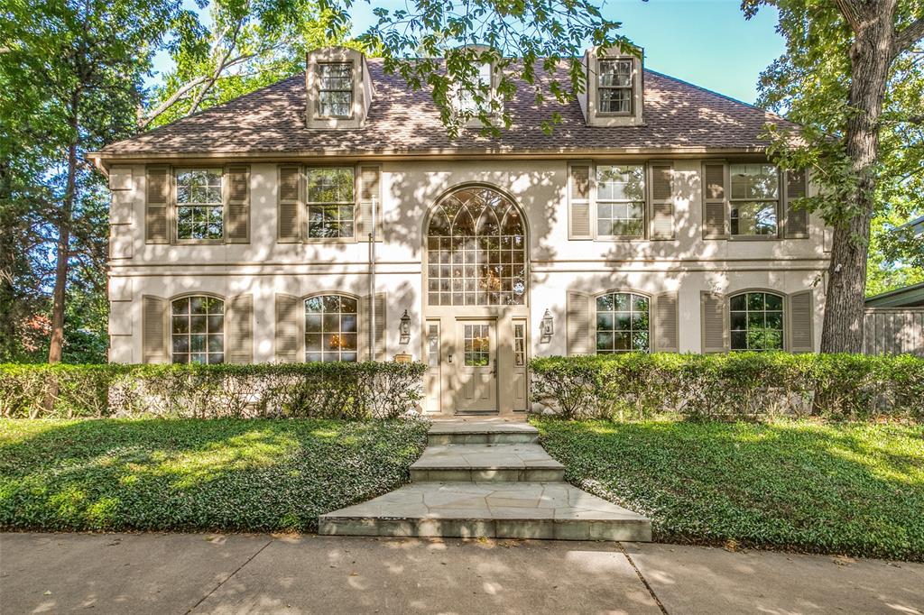 Wooded lot in a stately cul-de-sac, this French chateau style home on over nearly an acre of Kessler Park. Custom-built, with only 2 owners, its high ceilings & arched windows allow natural light, accentuated by a 37-arm chandelier in the grand foyer. A beamed, mirrored ceiling in the dining room & a marble fireplace & tall, arched doors in the living room. The two-tier den shares a FP with the living room & includes built-in seating. The kitchen includes granite countertops & SS appliances & pull-out pantry. Primary suite upstairs includes a GFP, jacuzzi & beverage refrigerator with separate vanities & closets. Additionally, from the master is an adjacent room with views of the backyard that could be used for a number of purposes. 2 more upstairs beds share a bath. A potential fourth bed down could also be used as an office. A circular drive provides entry to the front of the property, and a rear entrance through a tall privacy fence provides gated access to the garage and dog run.