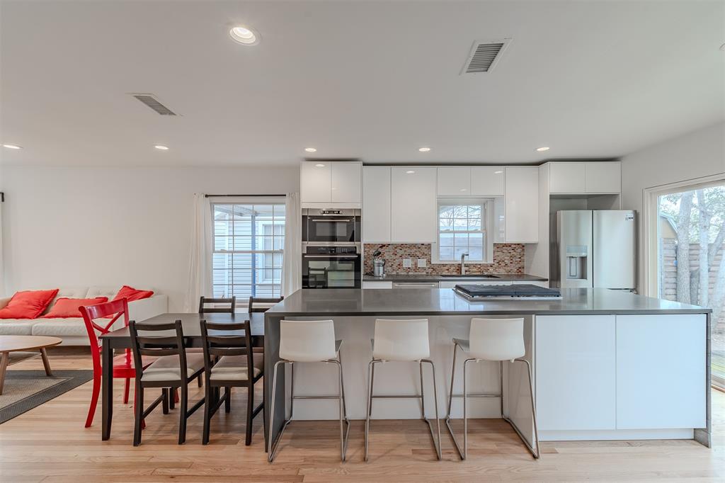 This charming cottage in the heart of Little Forest Hills offers the perfect blend of original character and modern sophistication. Nestled on a serene, tree-lined lot just a few blocks from White Rock Lake, this home invites you in with its welcoming charming curb appeal and thoughtful updates throughout. Step inside to discover a bright, open interior filled with natural light, gleaming hardwood floors, and clean-lined elegance. The spacious master bedroom provides a peaceful retreat, while the beautifully updated bathroom exudes contemporary style. The fully remodeled kitchen and living spaces seamlessly combine charm with luxurious modern touches, creating an inviting atmosphere for everyday living and entertaining. Outside, the oversized, fenced backyard is a true oasis, complete with a wooden deck perfect for relaxing or hosting gatherings. The lot offers endless possibilities to expand or add your personal touch. Plus, the garage features a fantastic flex space, ready to be transformed into a home office, studio, or workout area. Situated in an area buzzing with new construction and just moments from the natural beauty of White Rock Lake, this home is a rare find. Don’t miss the opportunity to make this gem your own!