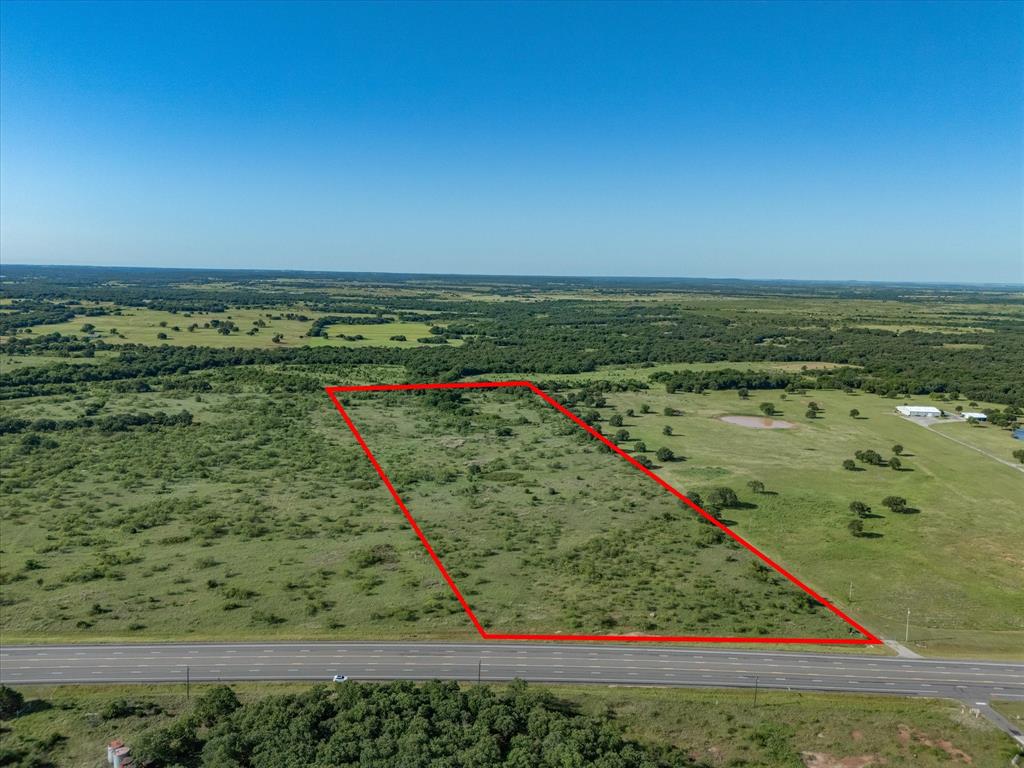 This 26.90-acre property offers outstanding frontage along Highway 82 in Nocona. With a combination of mesquite trees and native grasses, the land provides a naturally rustic setting with minimal upkeep required. Its flexible zoning potential makes it suitable for either commercial development or a residential homesite.

Known for its small-town atmosphere and scenic countryside, Nocona features a warm and inviting downtown area filled with charming boutiques, local shops, cozy coffee spots, and hometown dining options. Surrounded by rolling hills, peaceful landscapes, and outdoor recreation opportunities, the area offers the perfect blend of rural beauty and community charm. Whether you’re planning to build a country home, weekend getaway, or invest in future development, this property provides convenience, tranquility, and endless potential.