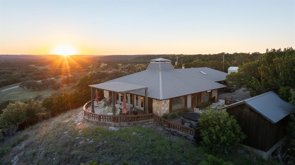 Imagine savoring every sunrise and sunset from your home atop the high elevation, overlooking your immaculately maintained turn-key ranch in the historic Norse District of Bosque County. The nicely appointed 2,000 sf home has 3 bedrooms and 3 baths, and spacious living and dining areas accented by a large rock fireplace, vaulted ceilings and loads of natural light. Multiple patios and porches expand the living space to the outdoors. The second home, constructed in 2010, is approximately 1,750 sf with an open floor plan and space to accommodate 7 guests. 

A 3-stall metal horse barn with electricity and water is ready for use. There are 6 deer pens in place from the previous breeding operation. The ranch is completely high fenced.

Excellent fishing opportunities await the new owner in the 5+ acre lake and the 2+ acres flooded habitat is ideal for duck hunting. The numerous ranch released deer exhibiting top quality genetics from the previous breeding operation are still in place. All other native wildlife species are found on the ranch including turkey, ducks, dove, hogs and varmint. This ranch offers opportunities for hiking, ATV trail riding, horseback riding, a shooting range and simply enjoying the beautiful views from the back deck of the main house.

Over a half a mile of Gin Branch creek runs through the southwestern portion of the property creating a 5+-acre lake and a 2-acre flooded waterfowl habitat. The ranch has two additional ponds and two stock tanks.

The rolling terrain offers an amazing elevation range from a low of 820 ft to a peak of 960 ft with areas of both open pasture and wooded cover.

The furniture in each home will convey with an acceptable offer. Contact Agent for a list of equipment that will convey with an acceptable offer.

The ranch is currently used for hay production. There is a pipeline easement in the northeast corner of the property.