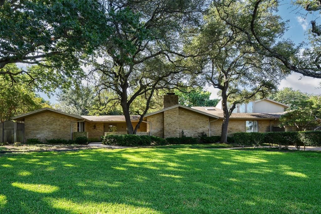 As one of the first custom-built homes in Russwood Acres, this mid-century modern landmark residence has been thoughtfully maintained by a single family for more than six decades. Spanning over 7,200 interior square feet on a half-acre lot framed by mature trees, the home retains its original character while presenting remarkable potential for transformation. It features six bedrooms, five baths, and multiple living areas designed around a private interior courtyard. This defining mid-century design element fills the home with natural light and reinforces the connection between indoor and outdoor living spaces. Generously scaled rooms and distinctive architectural details provide a timeless foundation to customize and modernize. Outdoor highlights include a pool, built-in grill, two-car garage, and two-car carport. Ideally positioned within the private school corridor, this is a rare opportunity to reimagine a spacious family home with enduring mid-century appeal.