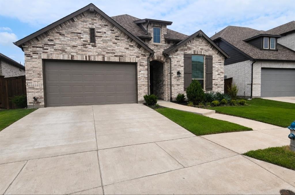 Welcome to this beautifully maintained 2021-built single-story home in the sought-after Waterscape community of Royse City. Offering 4 bedrooms, 2 full baths, and 2,138 square feet of thoughtfully designed living space, this home blends comfort and style on a manageable interior lot. The open-concept floorplan flows from a spacious living room with a cozy gas-log fireplace into a stunning kitchen featuring quartz countertops, a center island, breakfast bar, built-in cabinetry, gas cooktop, and a walk-in pantry. The private primary suite is a true retreat, complete with a sitting area with bay window, walk-in closet, and a spa-like ensuite featuring a garden tub, separate shower, dual vanities, and a built-in desk. Enjoy luxury vinyl plank flooring, decorative lighting, bay windows, and abundant natural light throughout. Step outside to a covered patio, private fenced backyard, sprinkler system, and rain gutters. Residents enjoy access to a community pool and Waterscape's resort-style amenities. Zoned to Royse City ISD. Don't miss this move-in-ready gem!