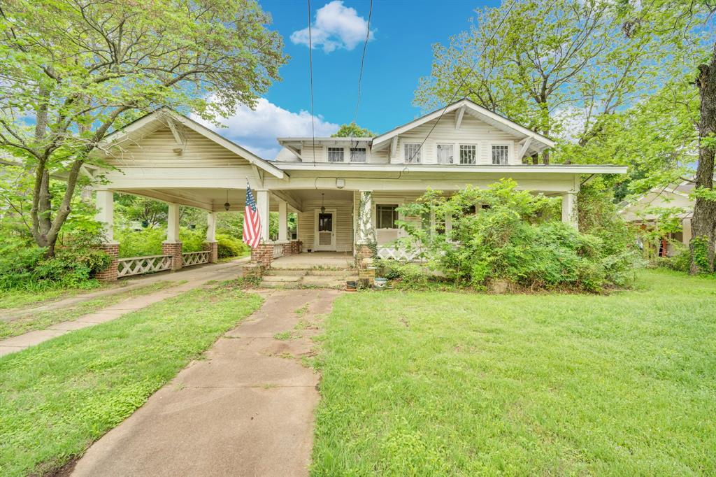 Investment opportunity in Hillsboro, Texas! This 3-bedroom, 2-bathroom home built in the 1940s offers 1,964 square feet plus a 454 square foot porch on a 0.41 acre lot in Hillsboro. The property is located in a good neighborhood on a large lot, providing excellent potential for the right buyer. The home features wood floors throughout that will need refinishing as part of a complete remodel. This property needs renovation and is being sold as-is, making it perfect for investors looking for a flip opportunity, DIY enthusiasts ready to take on a project, or those seeking rental property potential. The property offers a 1-car carport and an additional 1-car stand alone garage for additional storage. With nearly 2,000 square feet of living space, a spacious porch, and a generous lot size in a desirable Hillsboro neighborhood, this property offers the potential to be transformed into a charming home. Bring your vision and renovation skills to create a beautiful residence or profitable investment. Priced to sell as-is for quick renovation and resale or rental income!