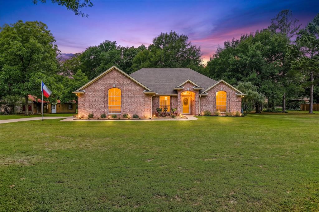 Experience the perfect blend of peaceful country living and everyday convenience in this beautifully maintained home situated on a picturesque 0.87-acre lot. With scenic views, mature surroundings, and plenty of space between neighbors, this property offers the privacy you’ve been looking for while still being close to city amenities.

Inside, the thoughtfully designed open-concept floor plan features 3 spacious bedrooms and 2 full baths with a desirable split-bedroom layout for added privacy. Large windows throughout the home fill the space with natural light and showcase the beautiful outdoor views.

The kitchen serves as the heart of the home, opening seamlessly to the living and dining areas—ideal for entertaining or everyday living. Complete with abundant counter space, generous storage, and a new refrigerator that conveys with the property, this kitchen is ready for its next owner.

The oversized primary suite is a true retreat, featuring a cozy sitting area and a spa-inspired remodeled bathroom with dual vanities, a walk-in shower, and a large walk-in closet. On the opposite side of the home, you’ll find two generously sized secondary bedrooms and a well-appointed guest bath.

Step outside to enjoy the large covered patio and extended deck overlooking the fenced backyard and charming greenhouse—perfect for gardening enthusiasts. Beyond the fenced area, the expansive property continues with three additional outbuildings offering endless possibilities for storage, a workshop, hobby space, or the ultimate man cave.

This property truly combines comfort, functionality, and the beauty of country-style living.