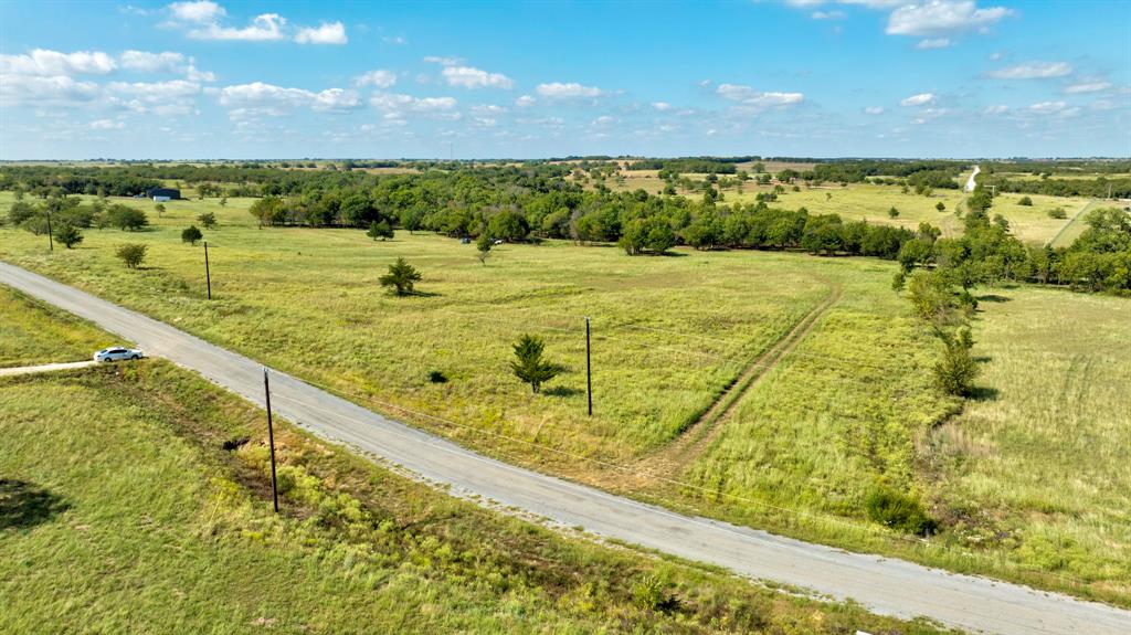 Discover the perfect blend of country tranquility and prime location with this remarkable 6-acre tract in the sought-after Eagles Perch community, just minutes north of Gainesville. Sitting on a private road, this property offers peaceful, scenic surroundings ideal for building your dream home, enjoying recreational use, or simply escaping the hustle and bustle of city life.
Only 3.8 miles from the Moss Lake boat ramp, you’ll have quick access to boating, fishing, and lakeside recreation. For those who travel, you’re within easy reach of both the DFW Metroplex and regional airports, while world-class entertainment and dining await just up the road at the WinStar and Choctaw casinos. This rare location gives you the serenity of country living with all the conveniences still within reach.
The 6 acres are dotted with beautiful natural landscapes, offering multiple build sites with room to create your ideal layout. Wildlife and open skies add to the recreational appeal, making it a haven for outdoor enthusiasts. For those seeking even more land, there is an option to combine this lot with MLS #21013106 for a total of 12 acres—ideal for expanding your vision into a full ranch estate, family compound, or larger recreational getaway.
This property captures the best of North Texas living—peace, beauty, and endless potential. Whether you’re looking for a weekend retreat, a forever home, or a smart land investment, this tract offers it all.
Call today to schedule your private showing and see why Eagles Perch is one of North Texas’ hidden gems!