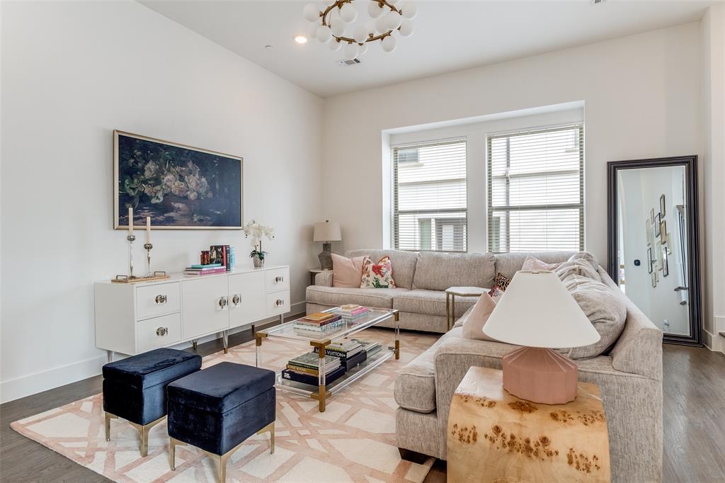 Located in the heart of Lower Greenville, this stylish corner-unit home combines a thoughtful layout, designer finishes, and exceptional walkability just steps from one of Dallas’ most vibrant entertainment districts. With $50,000 in upgrades, this beautifully designed home showcases soaring ceilings, hand-scraped hardwood floors, and oversized windows throughout. The open-concept layout connects the living, dining, and kitchen areas, anchored by a chef-inspired kitchen featuring Calacatta quartz countertops, an oversized island, abundant cabinetry, designer lighting, and updated hardware. The spacious primary suite includes an expansive walk-in closet, while the ensuite bath features dual vanities, Edward Martin checkerboard flooring, marble accents, and designer finishes. Two versatile flex spaces on the first and fourth floors provide endless possibilities - perfect for a home office, gym, media room, or creative space tailored to your lifestyle. Unwind on the private rooftop terrace, offering the perfect space for relaxing or entertaining. Additional highlights include an attached 2-car garage with overhead storage, a private fenced-in front yard with newly installed turf, and an upgraded water heater for added convenience. Stylish, functional, and ideally located, this move-in ready home offers the best of city living and everyday convenience. HOA includes water, sewer, trash, insurance, and pest control.